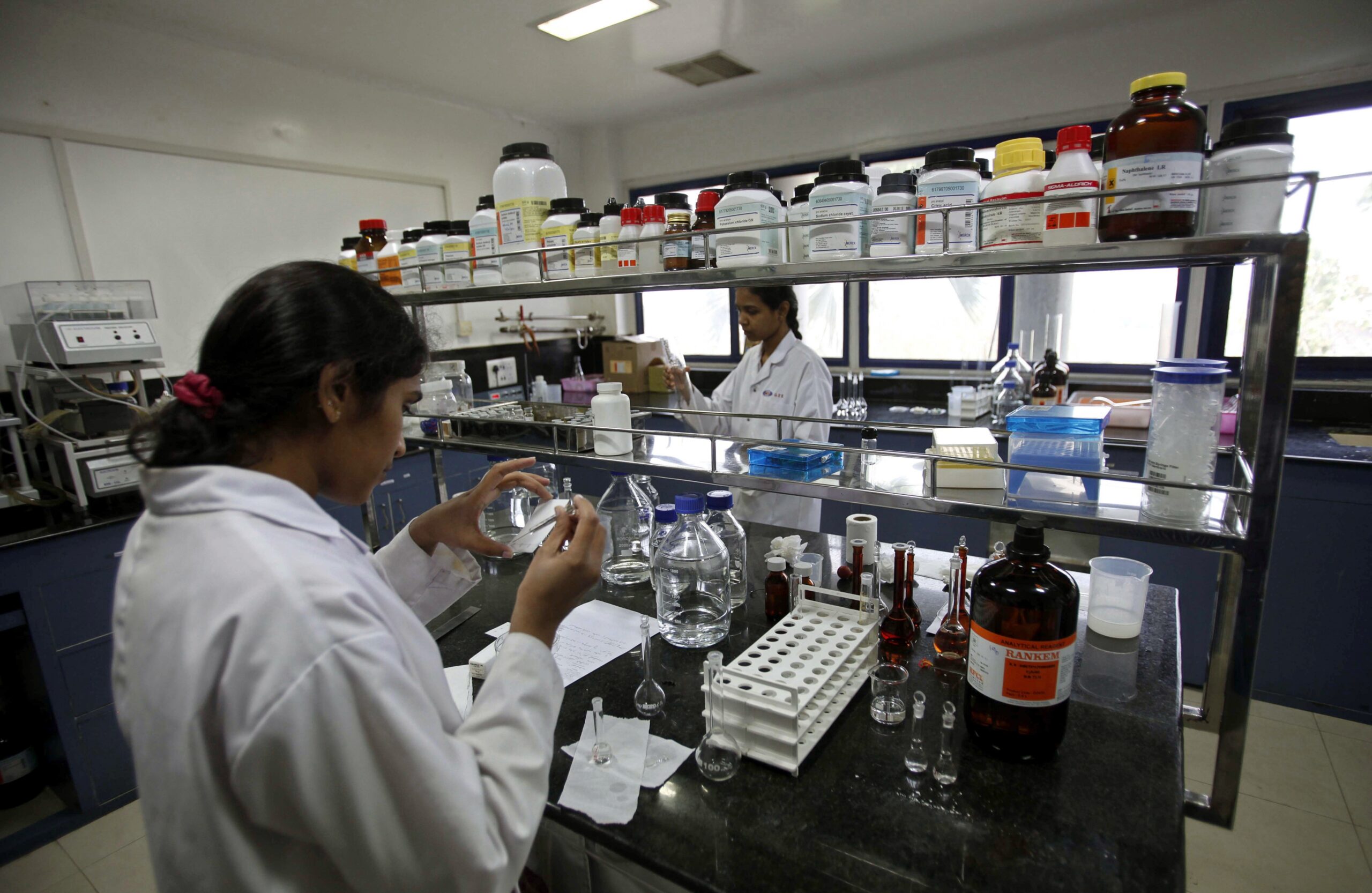Indian scientists work inside a laboratory of the Research and Development Centre of Natco Pharma