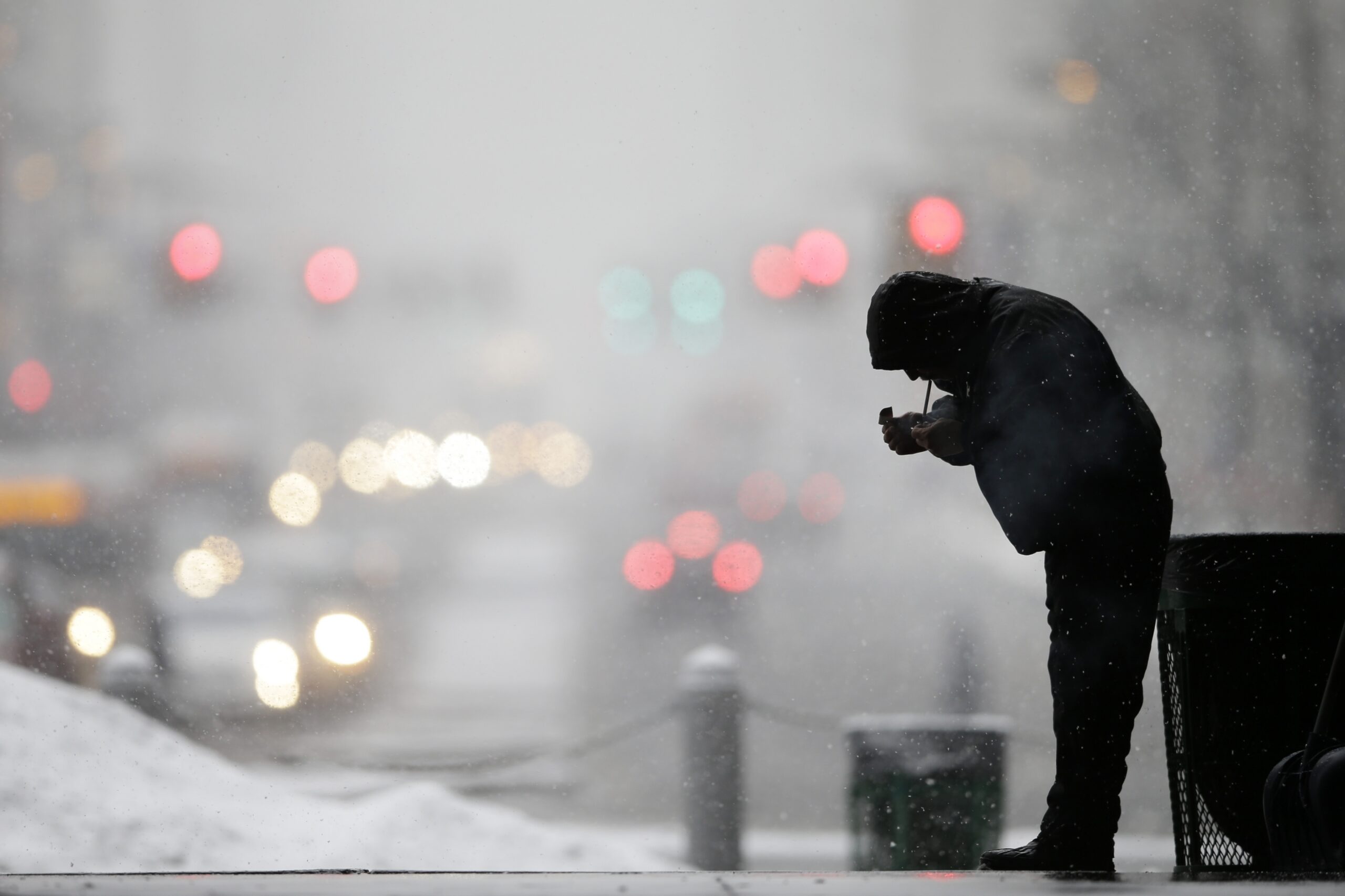 A man lights up a cigarette in winter