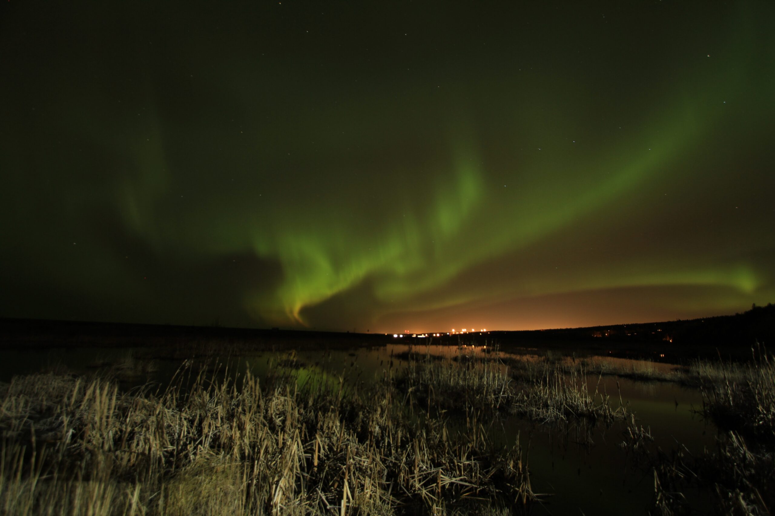 Northern lights (aurora borealis) illuminate the sky