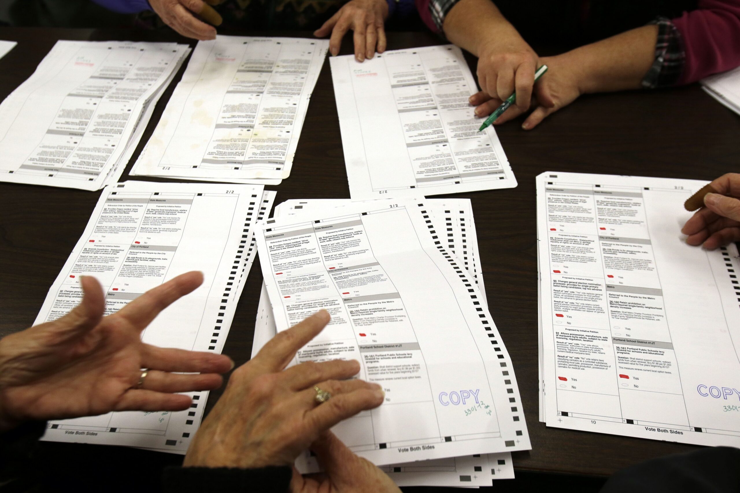 People recounting ballots