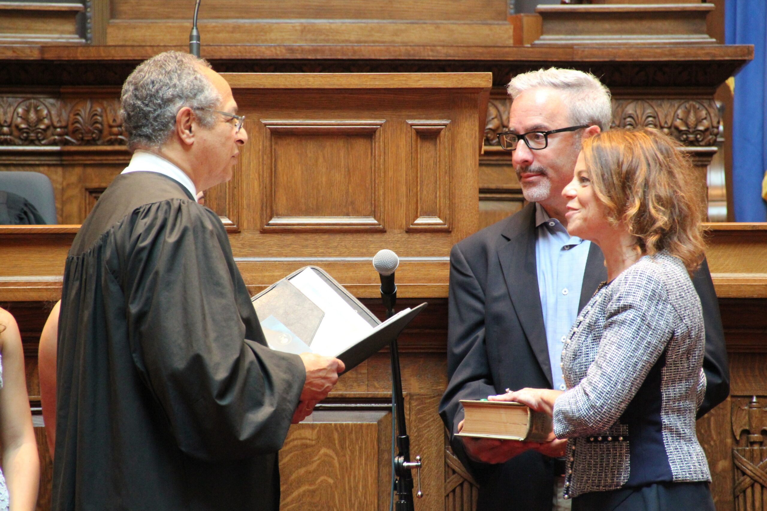 Former state Supreme Court Justice Louis Butler administers the oath of office to new Justice Rebecca Dallet