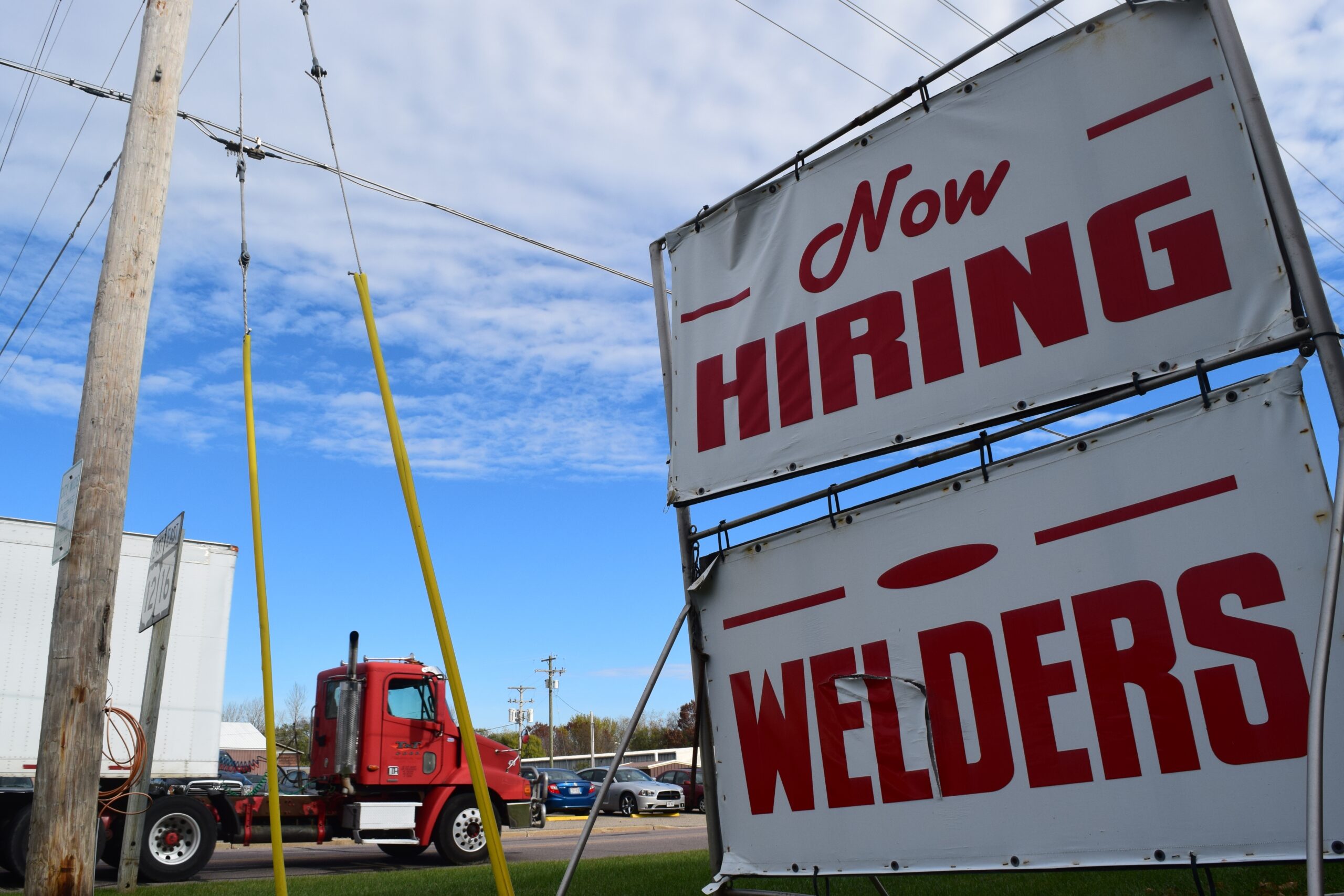 "Now Hiring Welders" sign