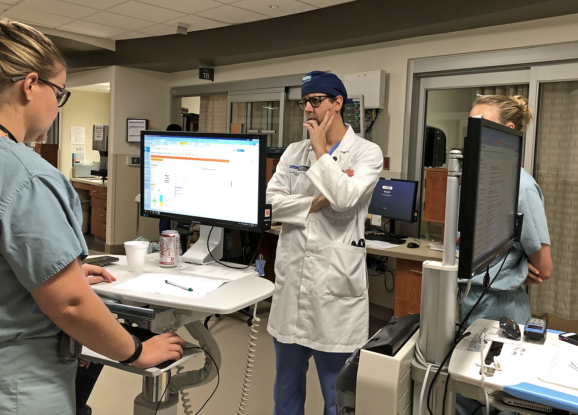 Dr. Marc de Moya listens to patient updates