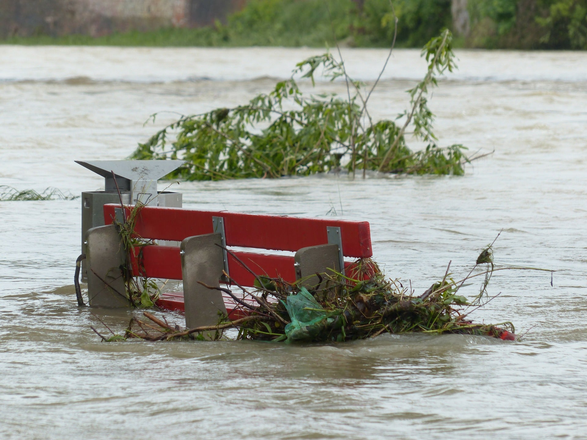 Bench surounded by high water.