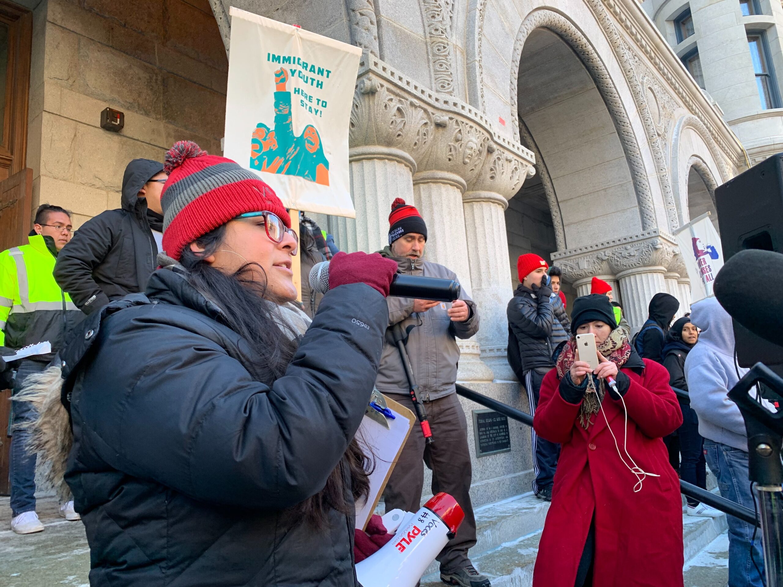 Alejandra Gonzales chanting to the crowd during a rally in support of DACA