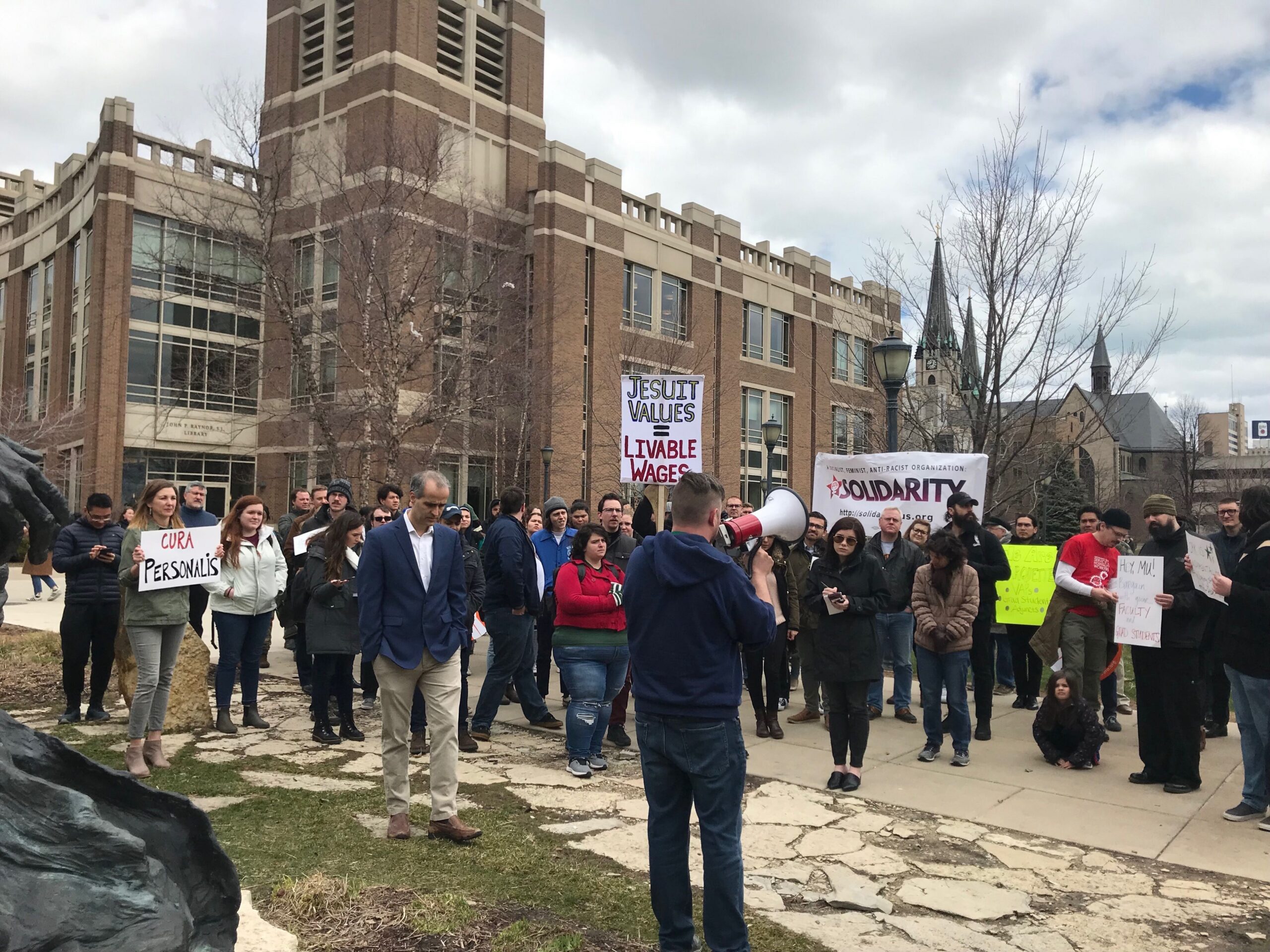 Marquette University faculty and graduate students held a rally