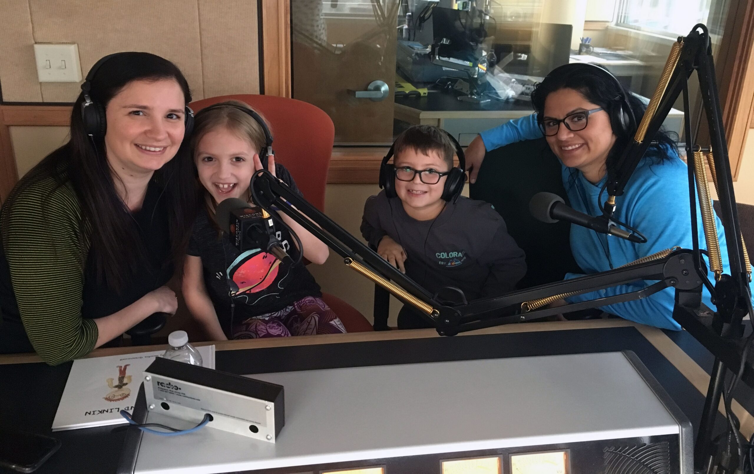 Naudia Greenawalt, second from left, with her mother, Dolores, left, and Linkin Eger, second from right, with his mother, Kelly, right, in WPR's Milwaukee studios.