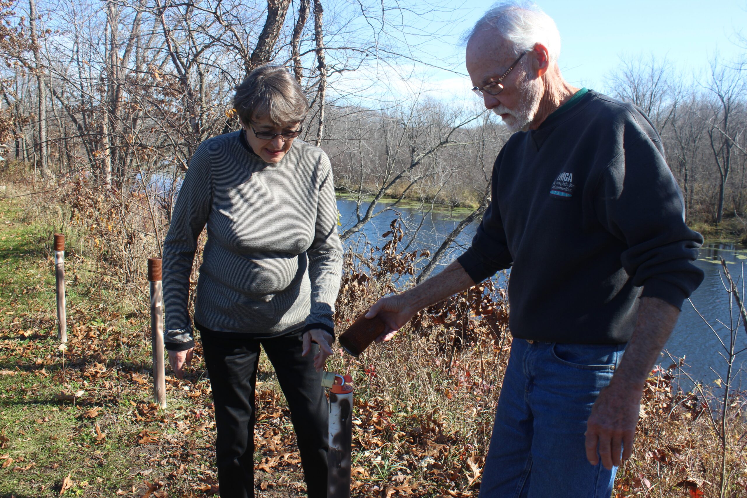 Doug and Sherryl Jones show a monitoring well on their property in rural Spring Green.