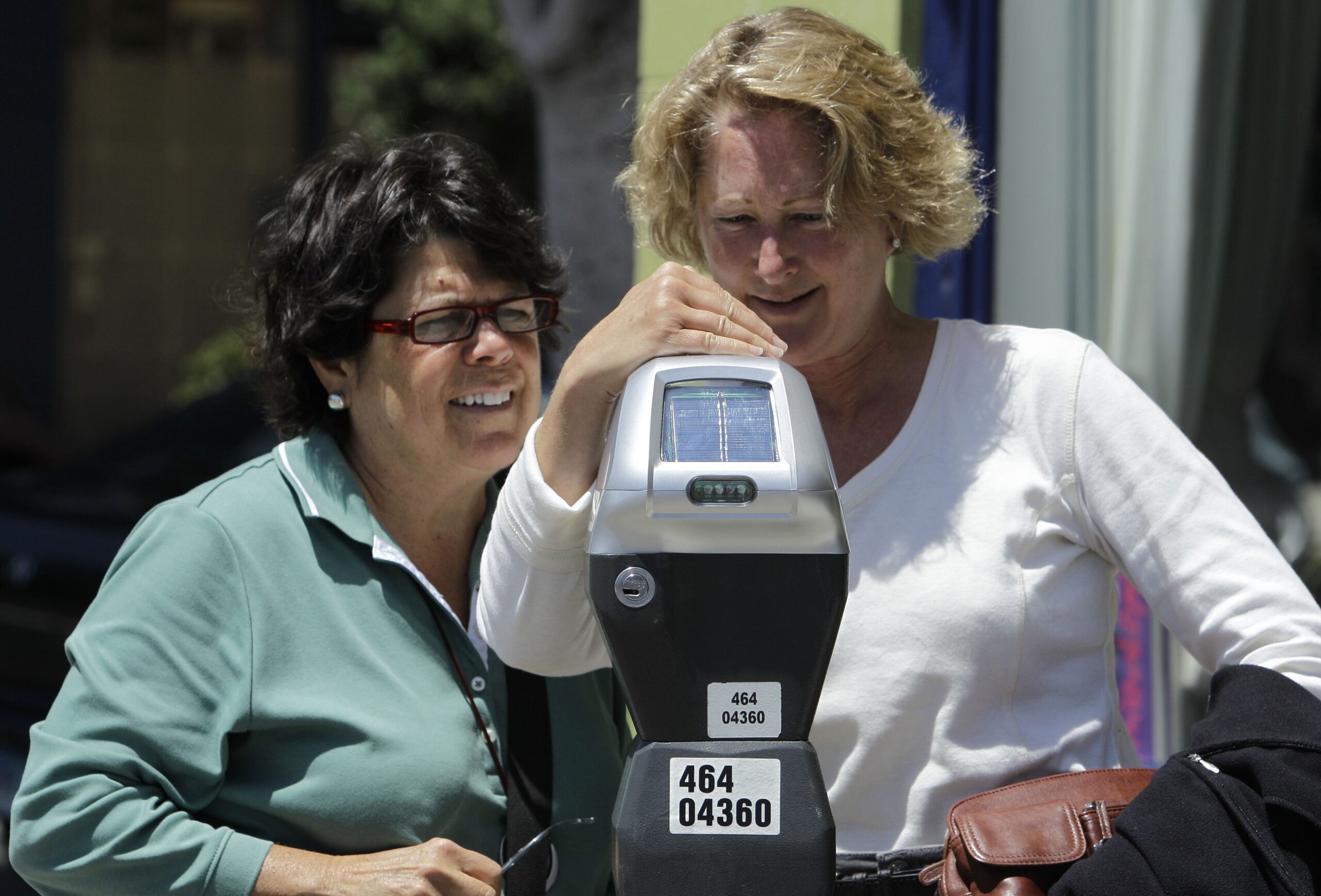 Women at parking meter