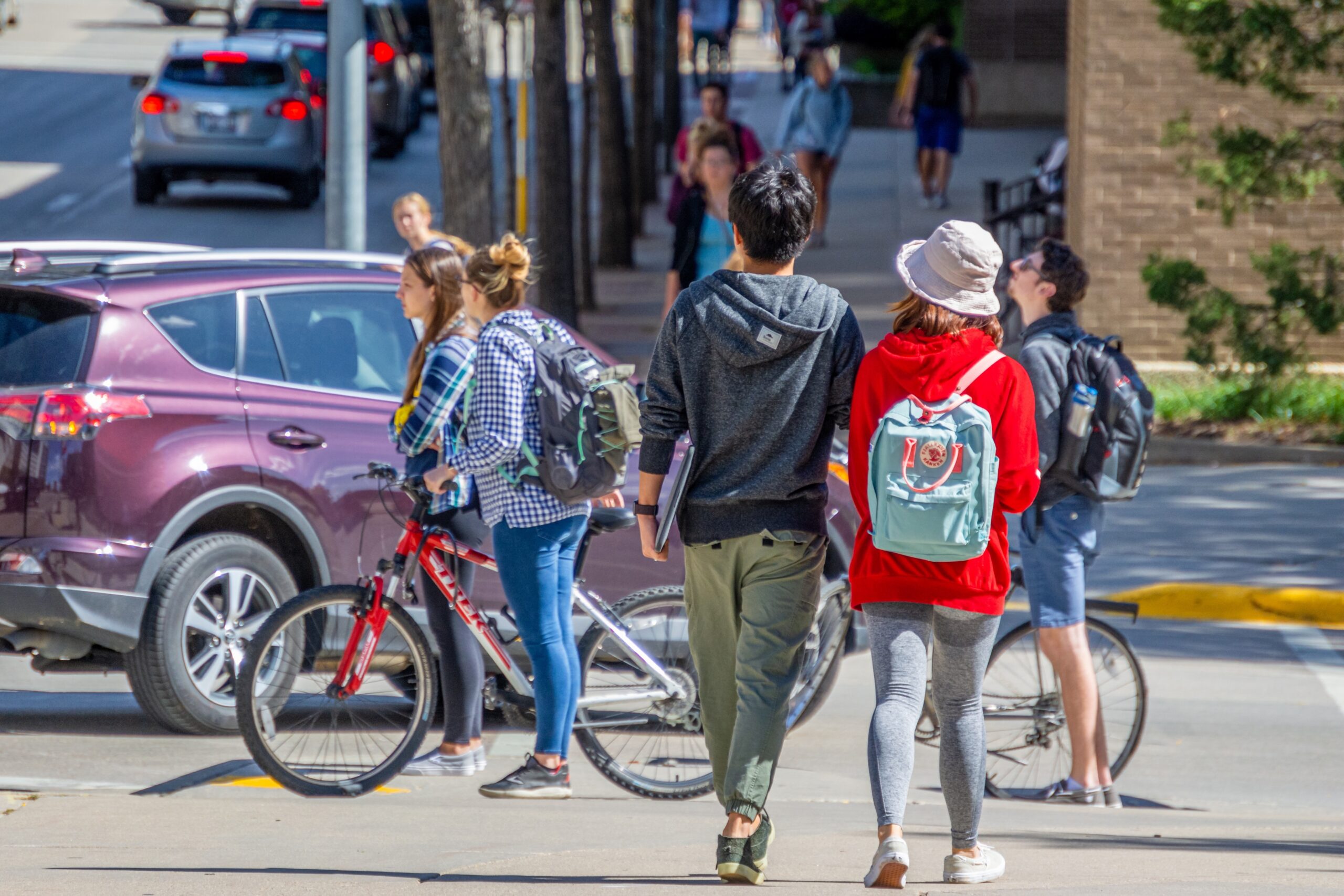 Students walking along Johnson St. on the University of Wisconsin-Madison campus.