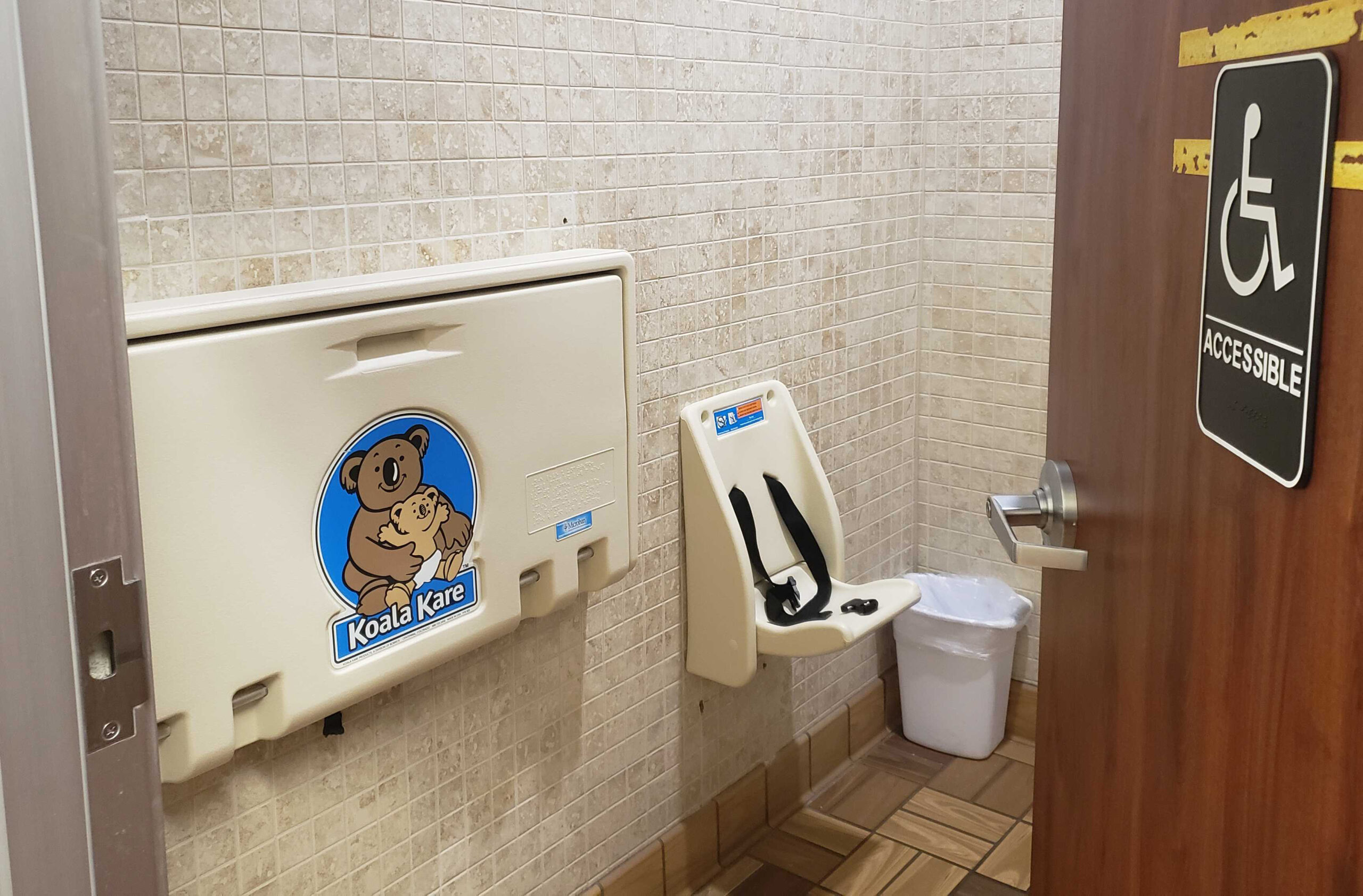A baby-changing station inside of a gas station in Eau Claire