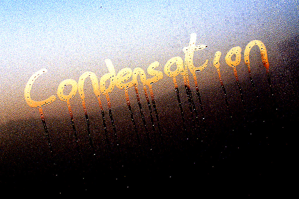 Window with condensation written on it.