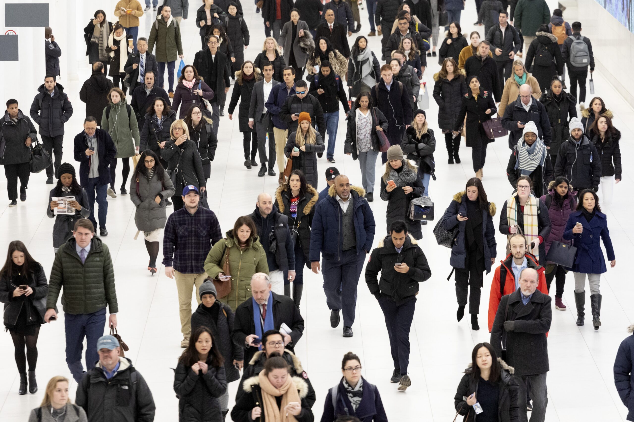 Commuters pass through the World Trade Center, Wednesday, Dec. 4, 2019 in New York