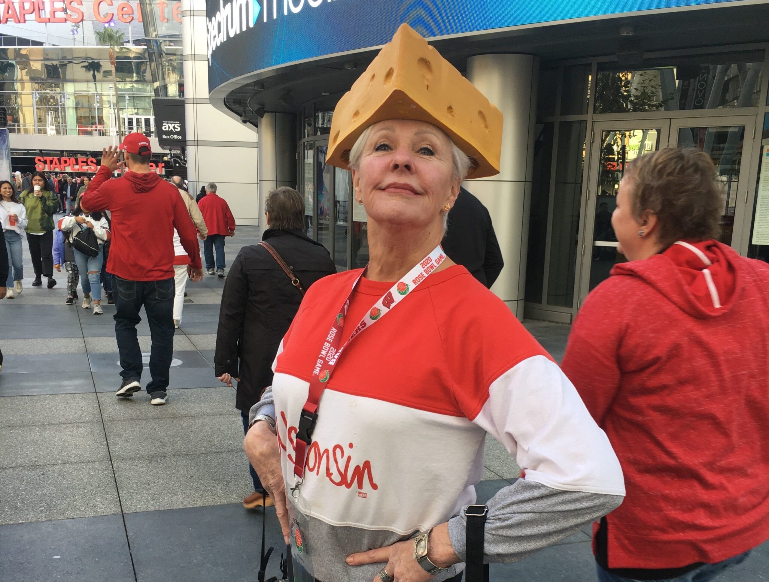 Badgers fan poses with cheesehead outside pep rally