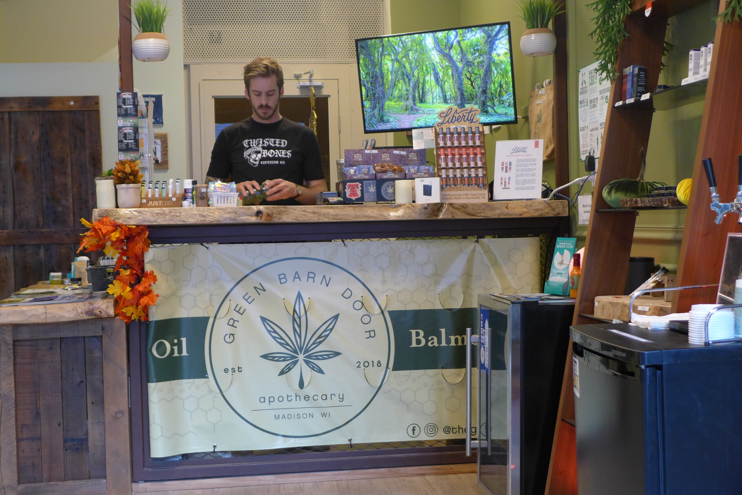 Ryan Barnes at his CBD shop, The Green Barn Door, in Madison