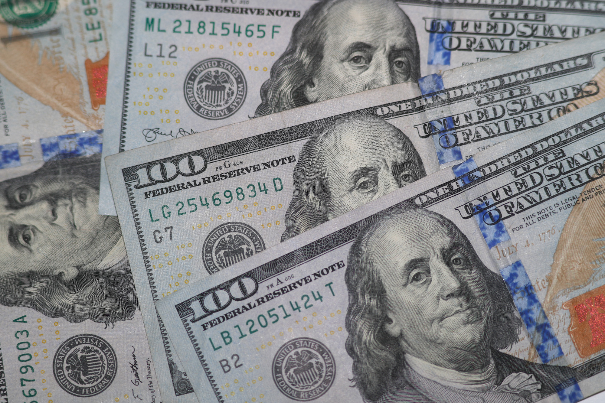 The likeness of Benjamin Franklin shown from $100 bills