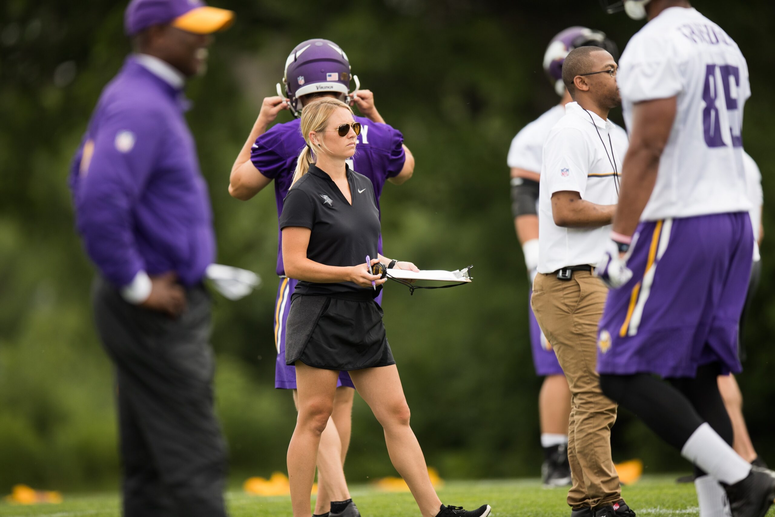 Kelly Kleine of the Minnesota Vikings evaluates players