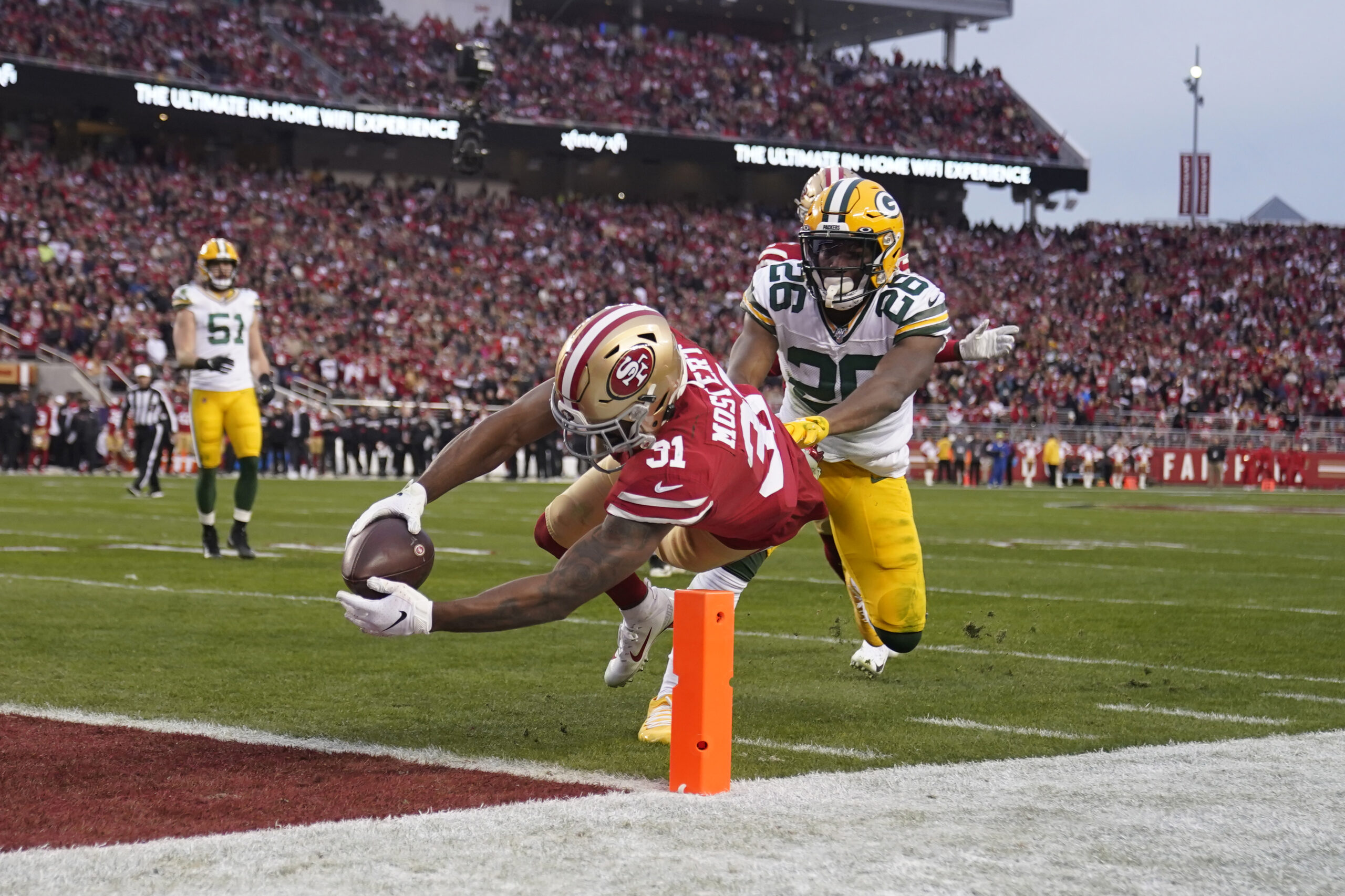 The San Francisco 49ers score on the Green Bay Packers
