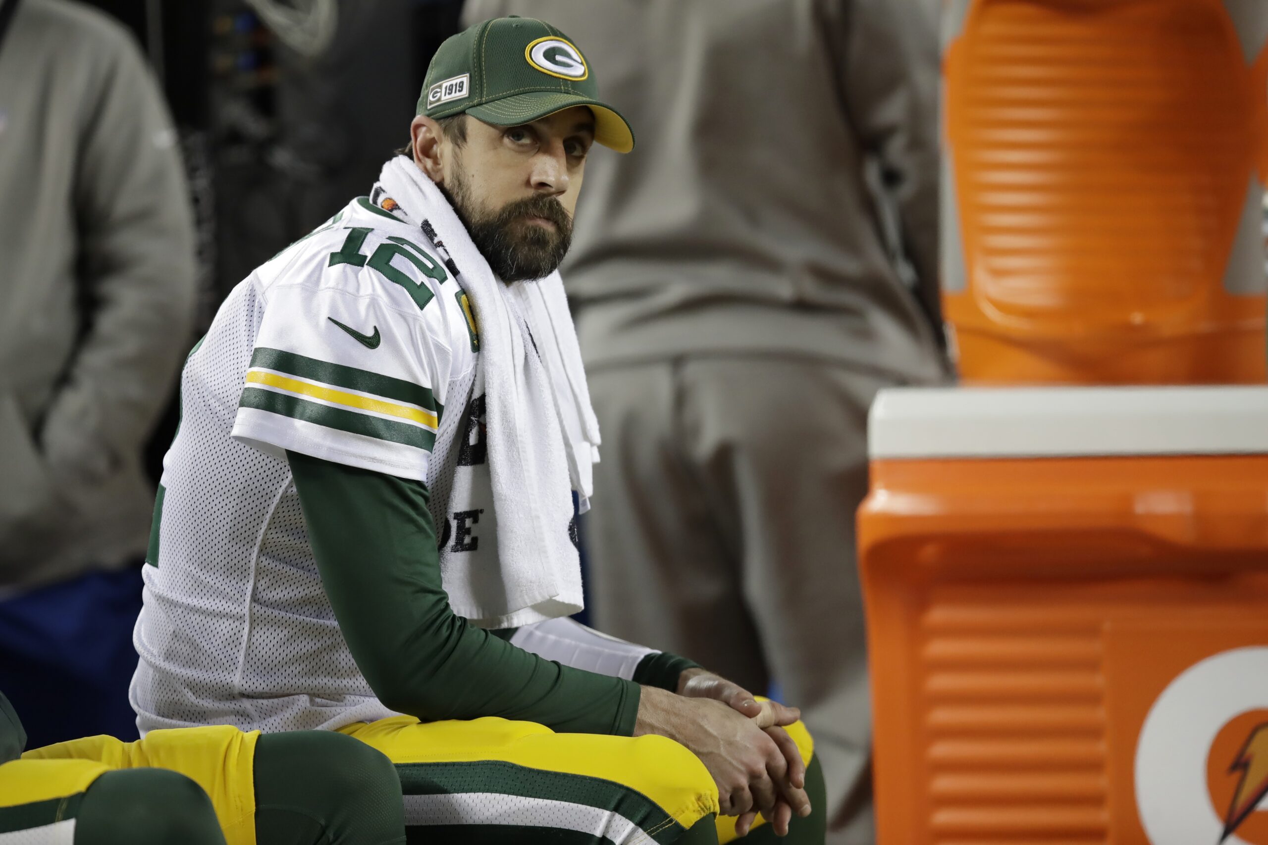 Aaron Rodgers sits on the bench