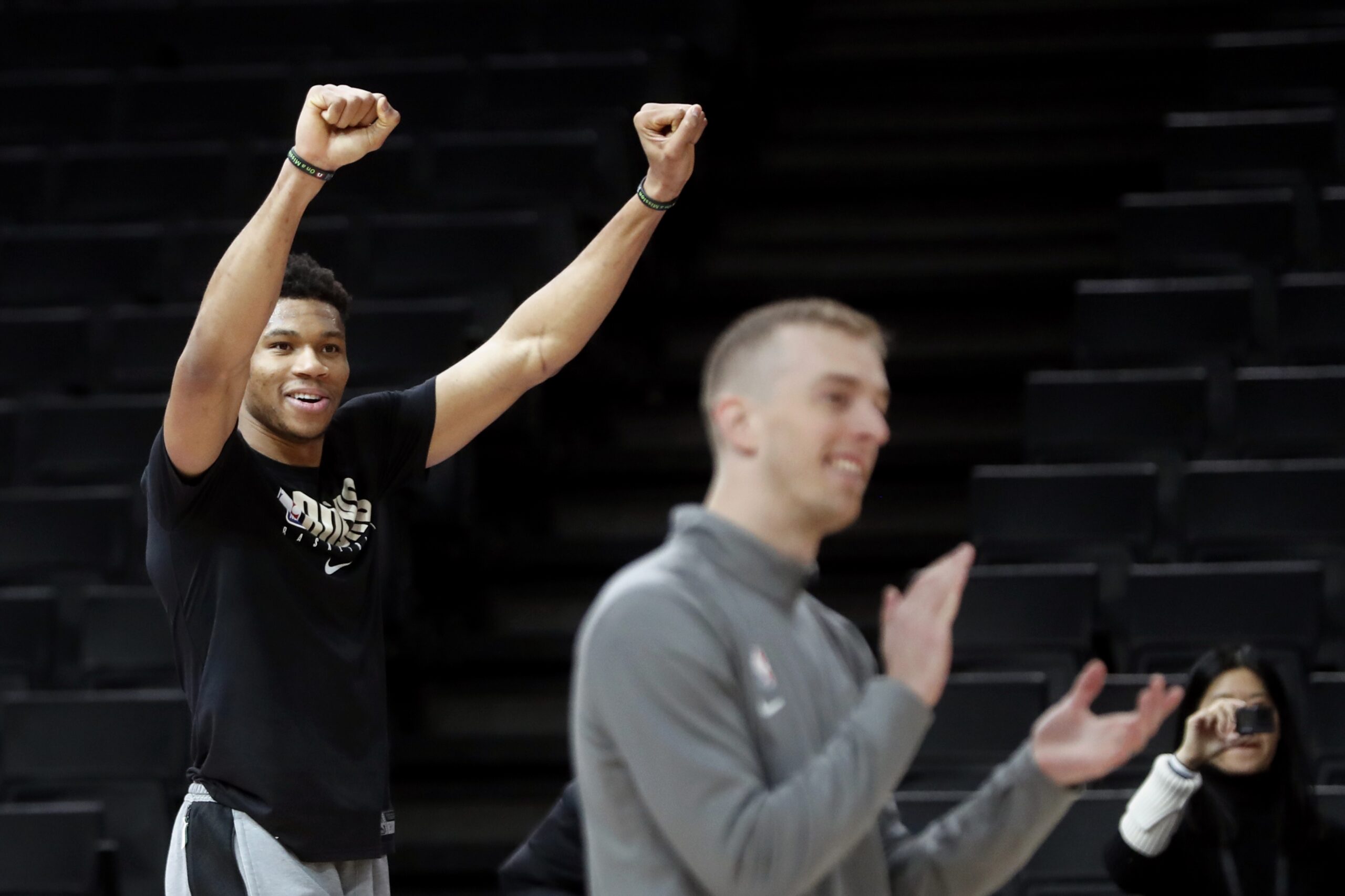 Giannis Antetokounmpo celebrates a basket at practice