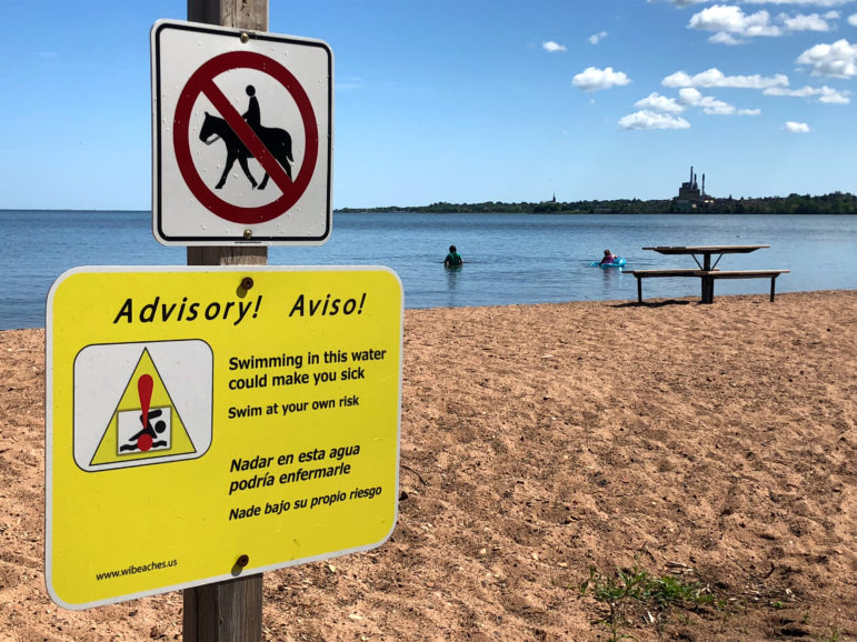 A sign warns of the risks of swimming at Lake Superior’s Maslowski Beach