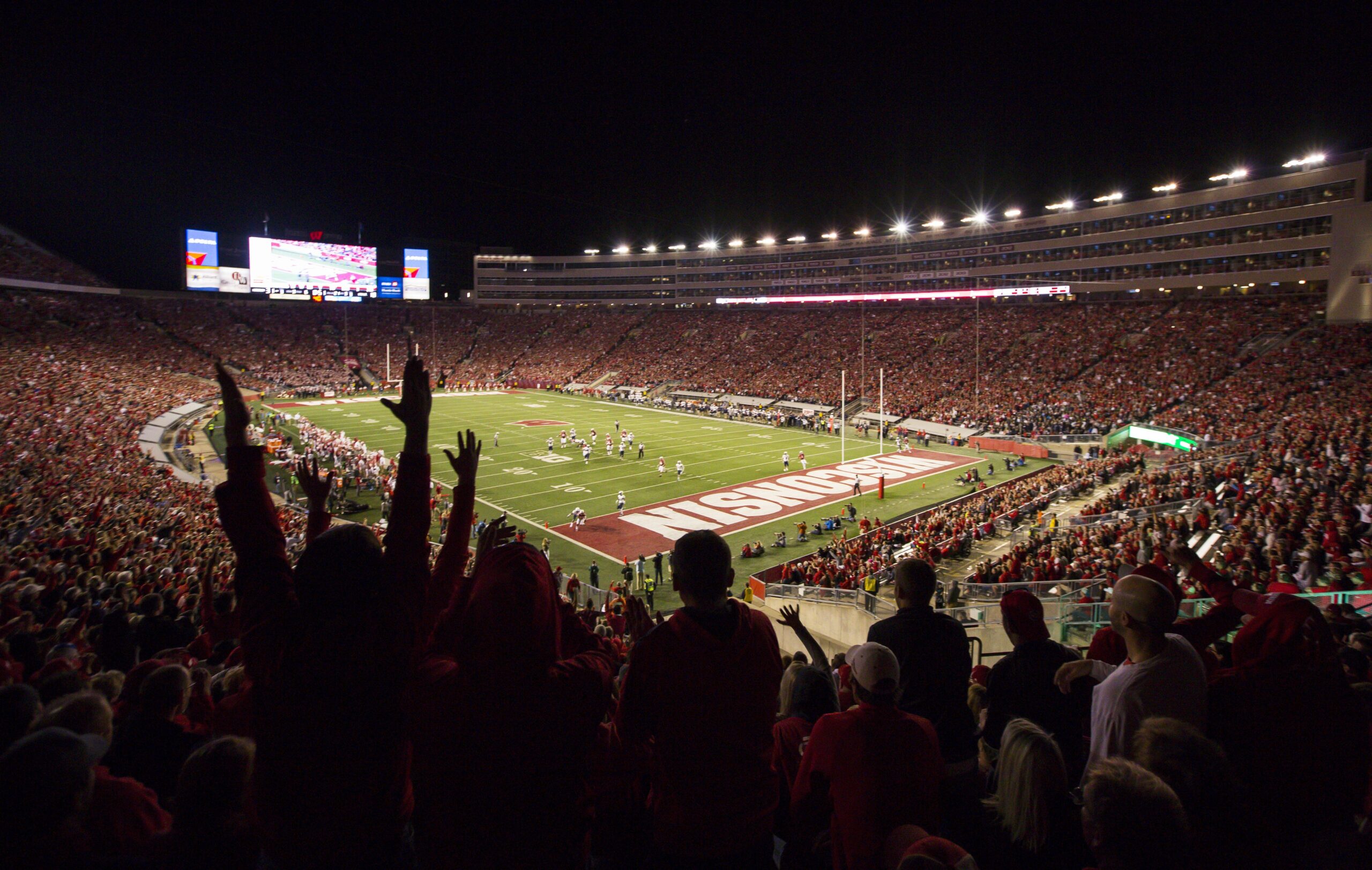 Wisconsin fans celebrate during night game at Camp Randall Stadium