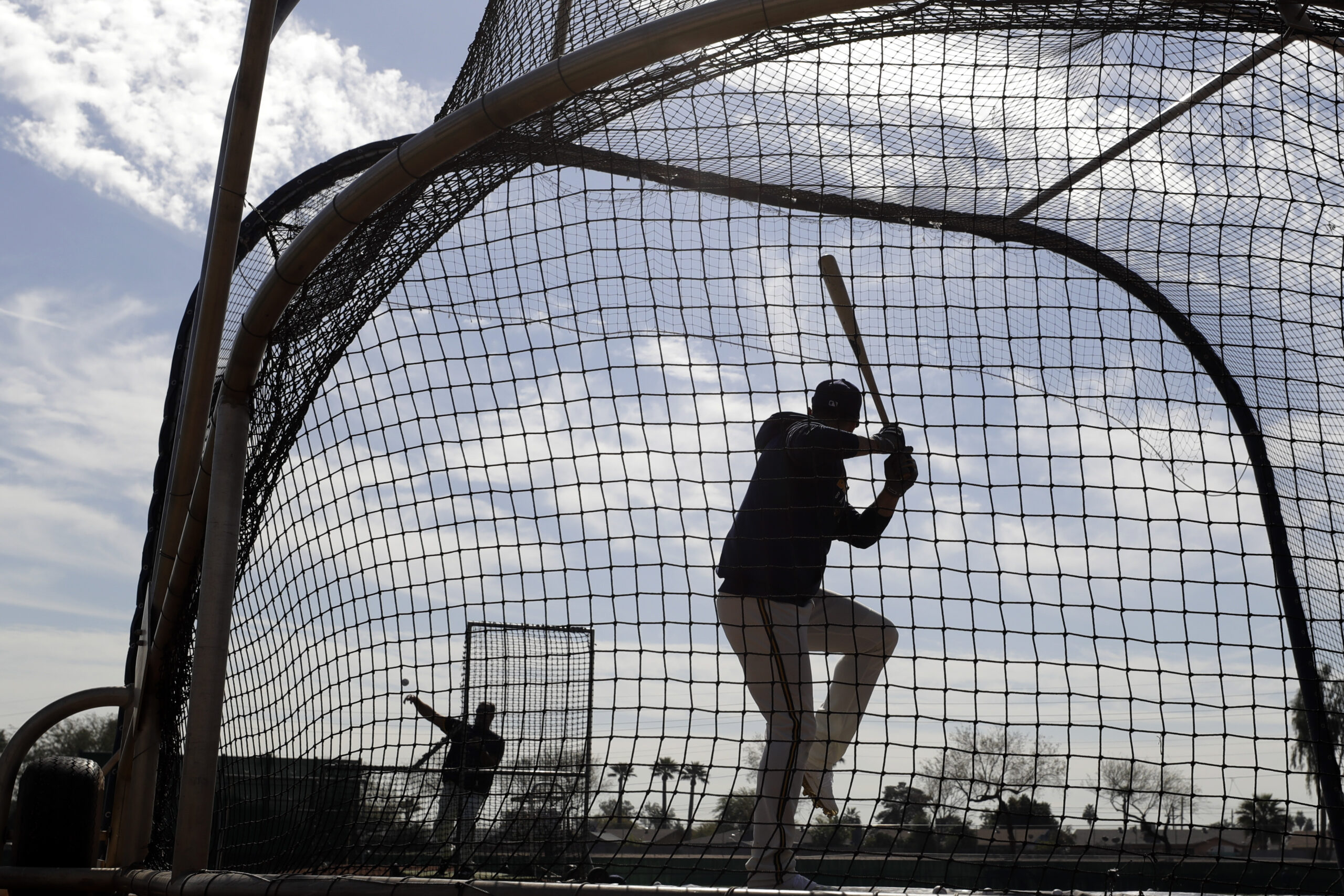 A Milwaukee Brewers player takes batting practice in Phoenix