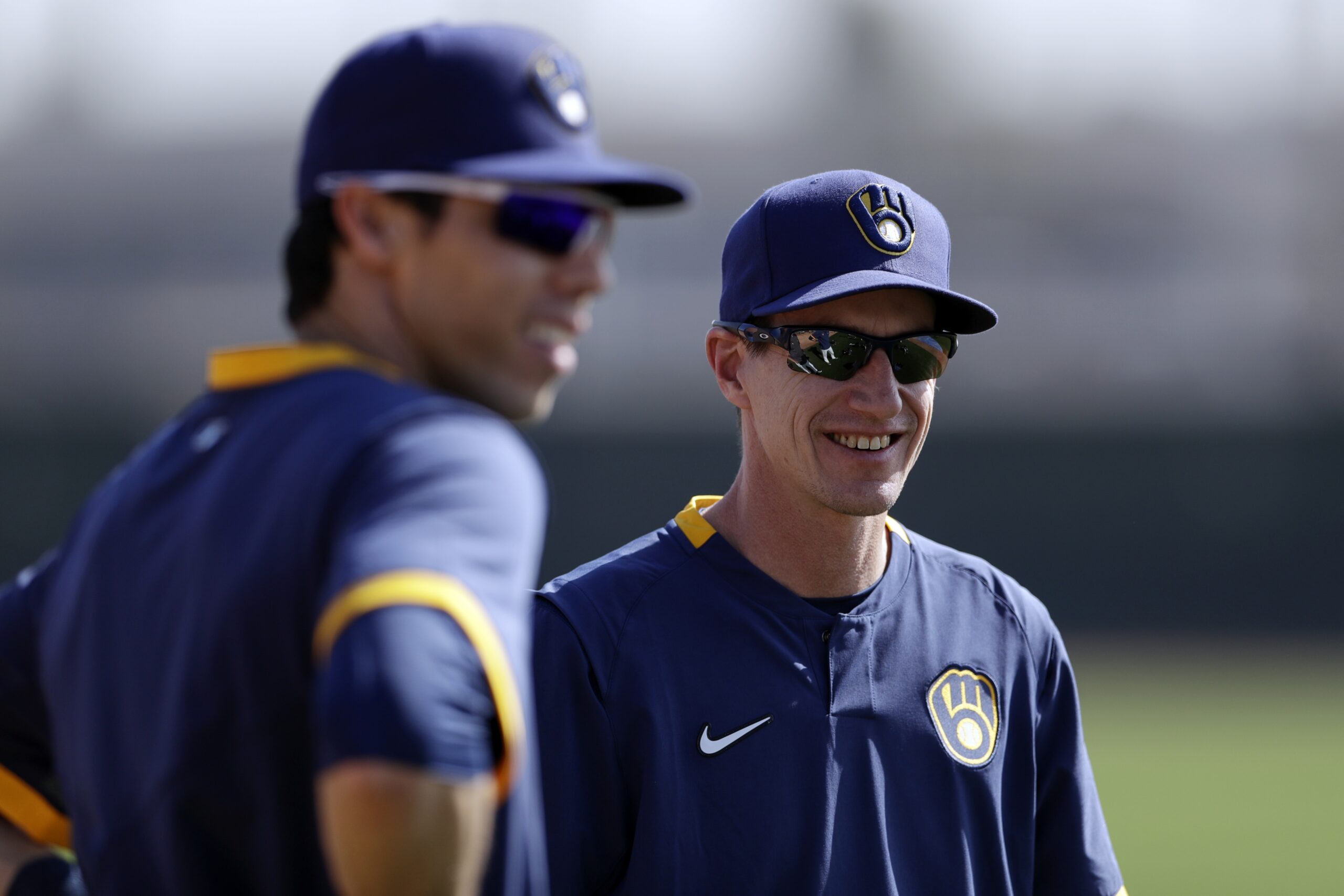 Christian Yelich and Craig Counsell chat at Spring Training