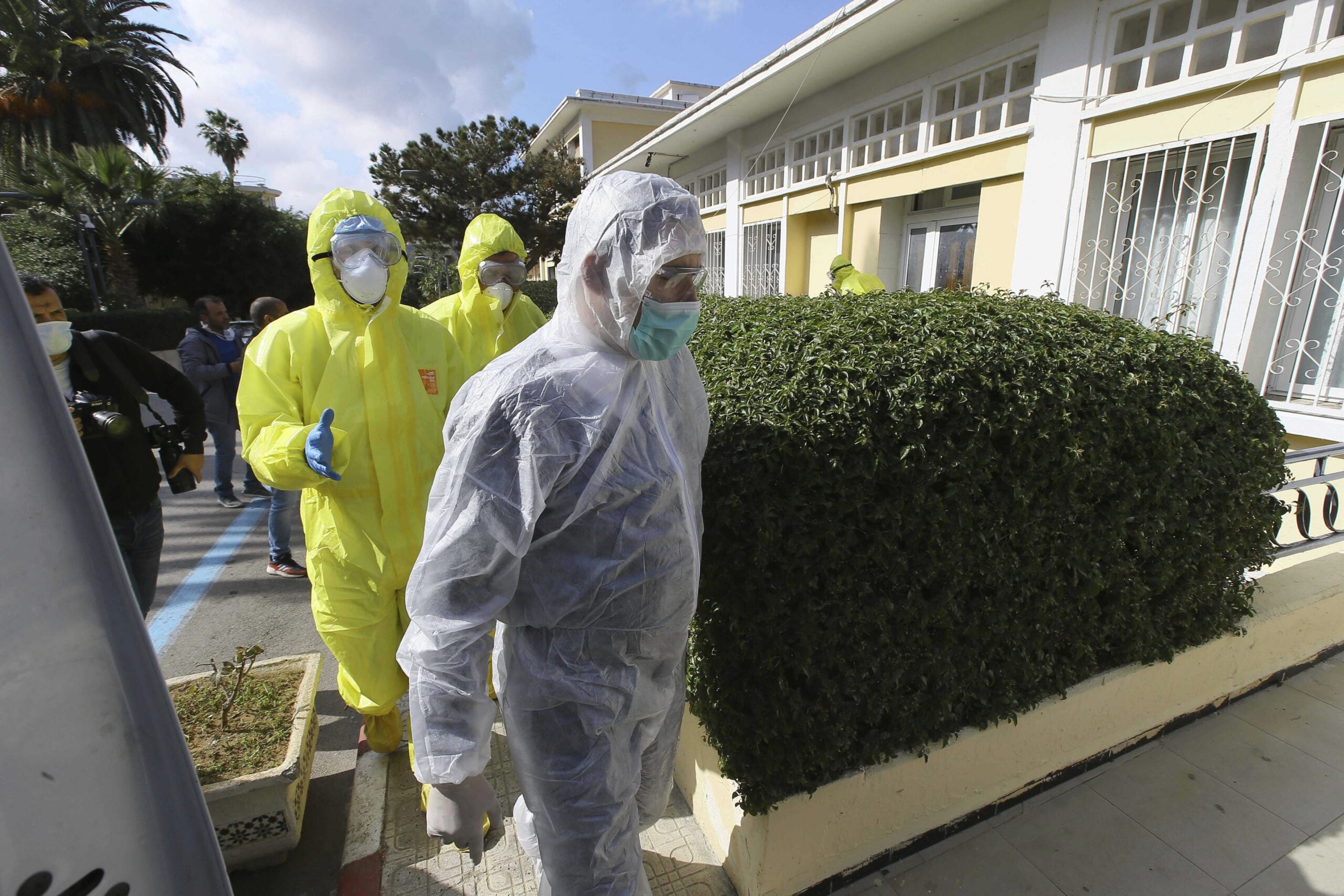 Medics walking outside clinic.