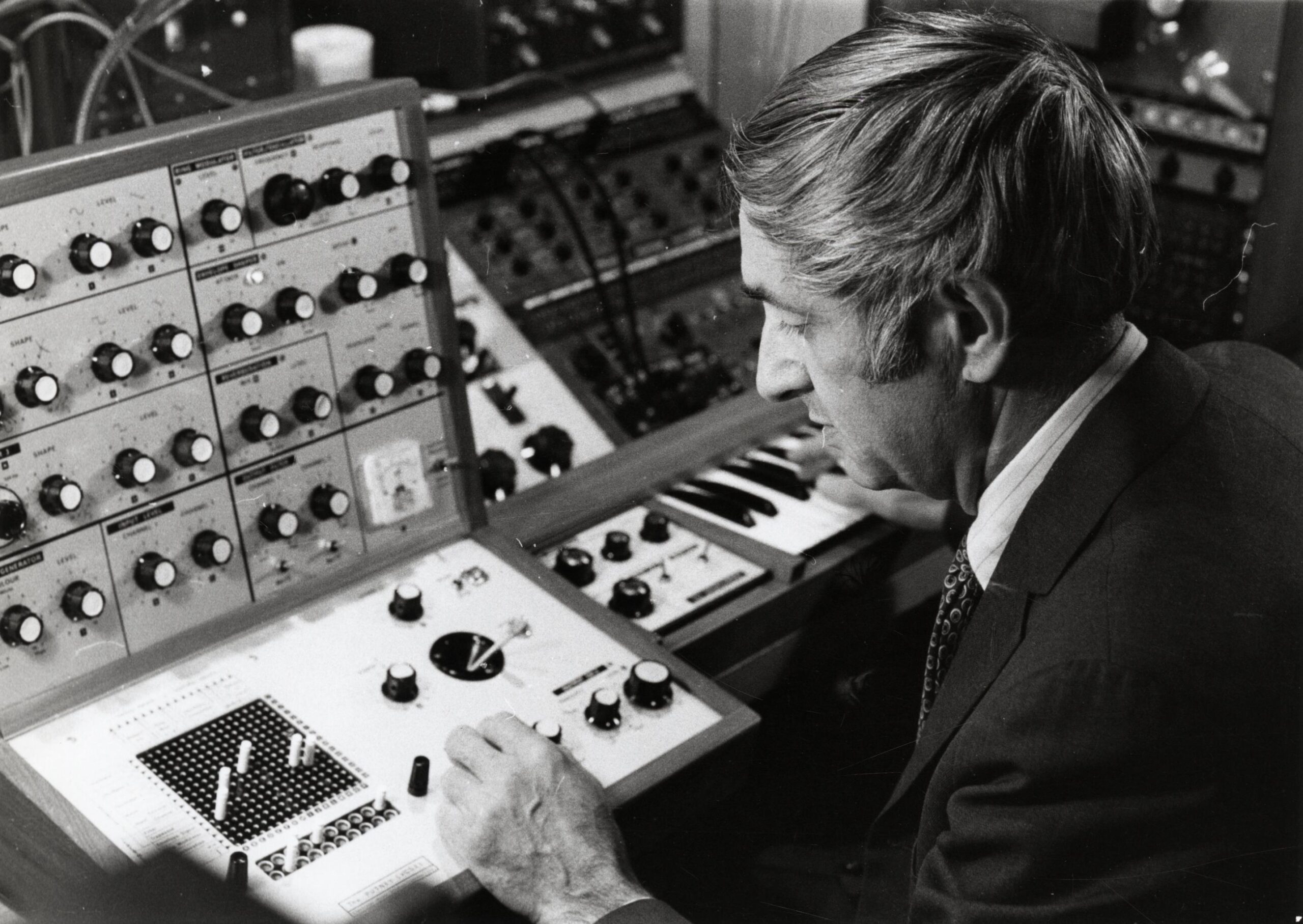 Composer Don Voegeli with his Putney synthesizer.