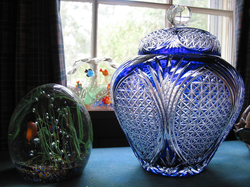 A blue glass vase for sale at an estate sale