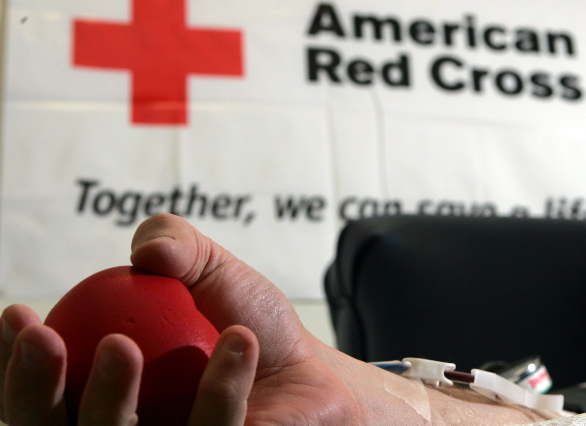 A blood donor squeezes a stress ball