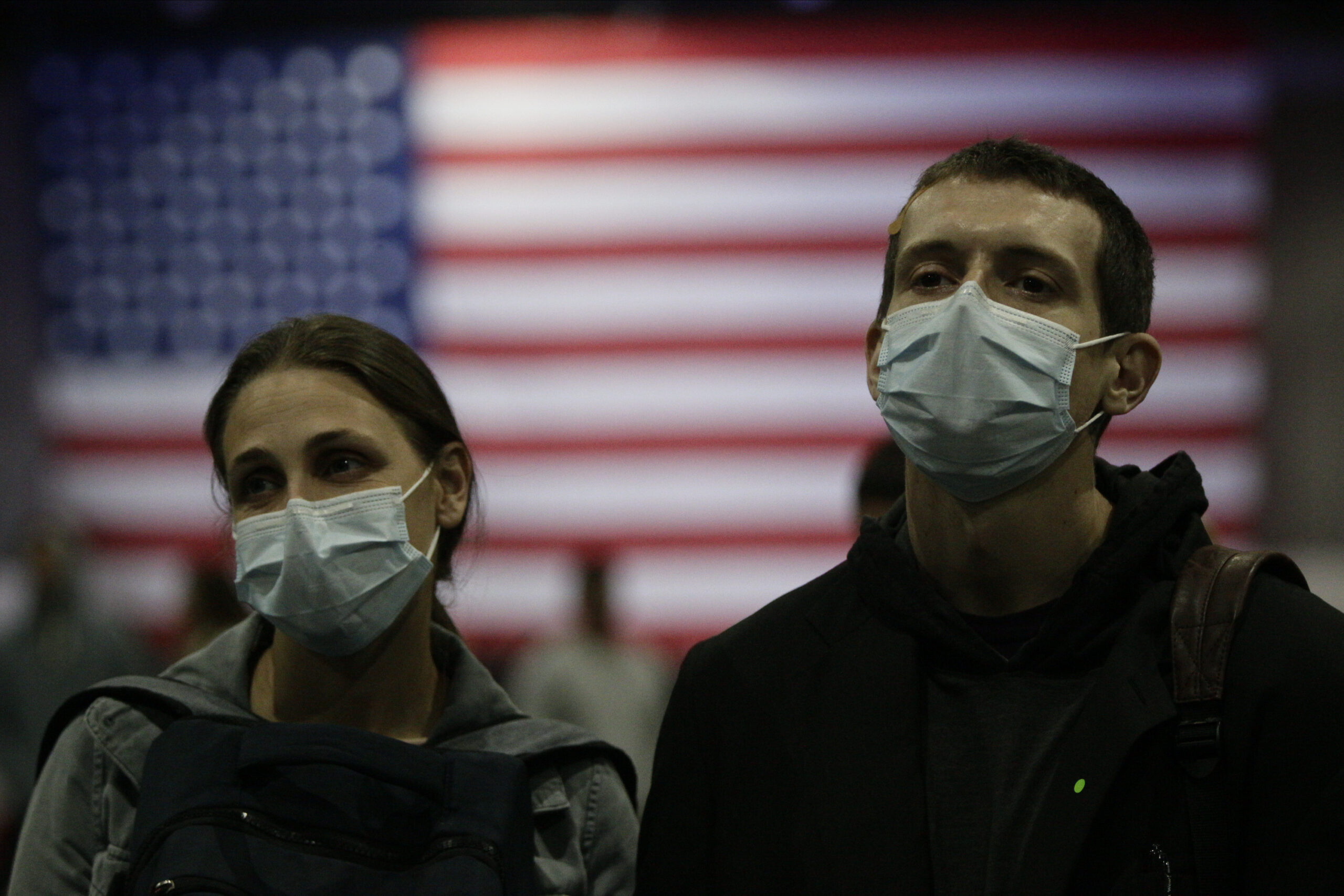 Political rally attendees wearing face masks