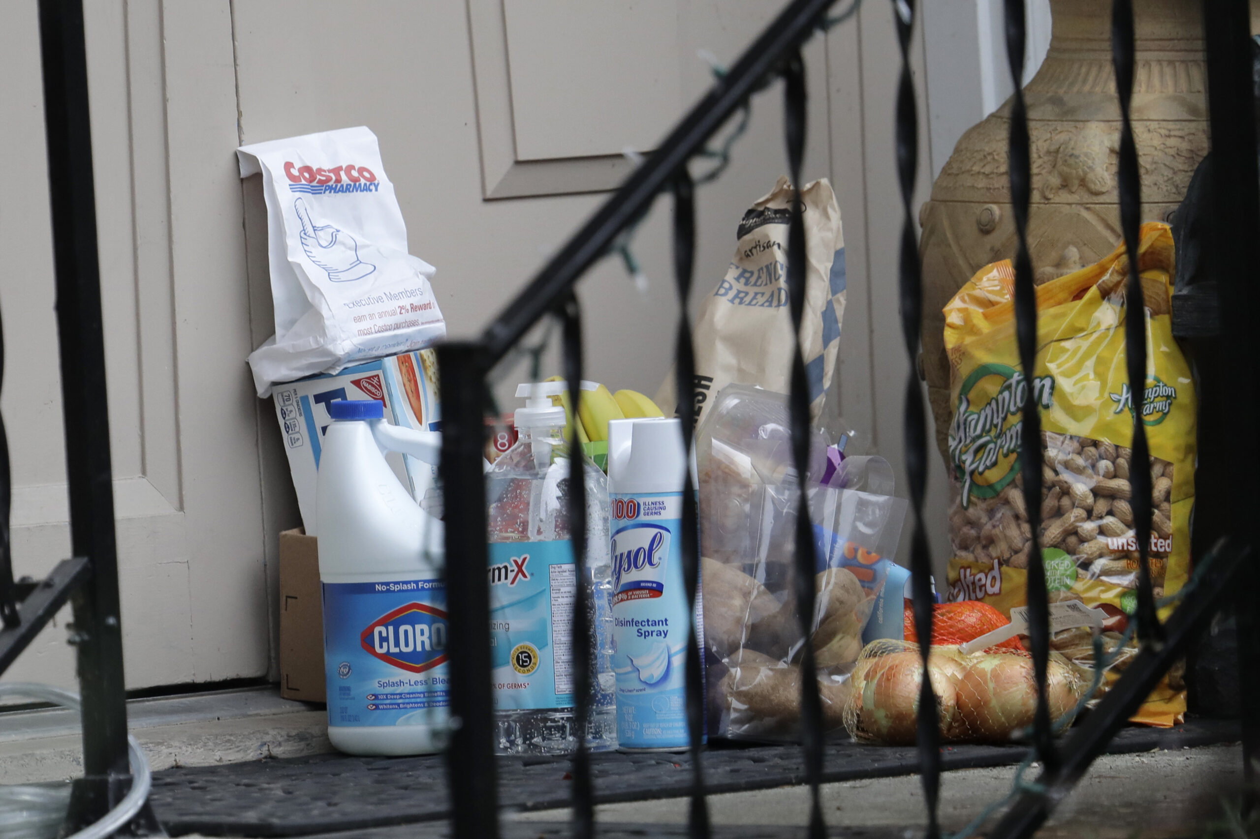 Groceries, cleaning supplies, prescription medicine and other items are shown on the front porch