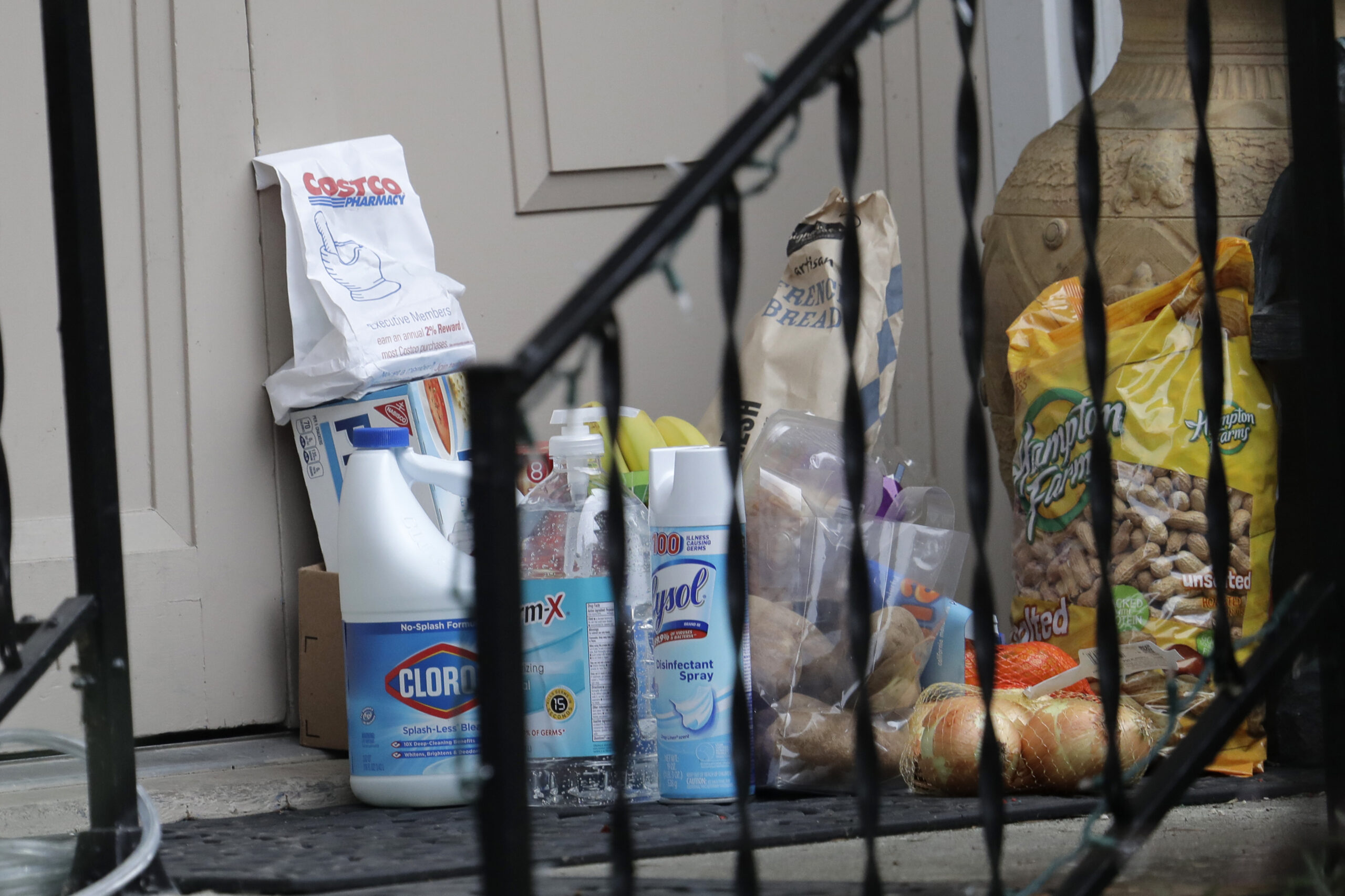 Groceries, cleaning supplies, prescription medicine and other items are shown on the front porch