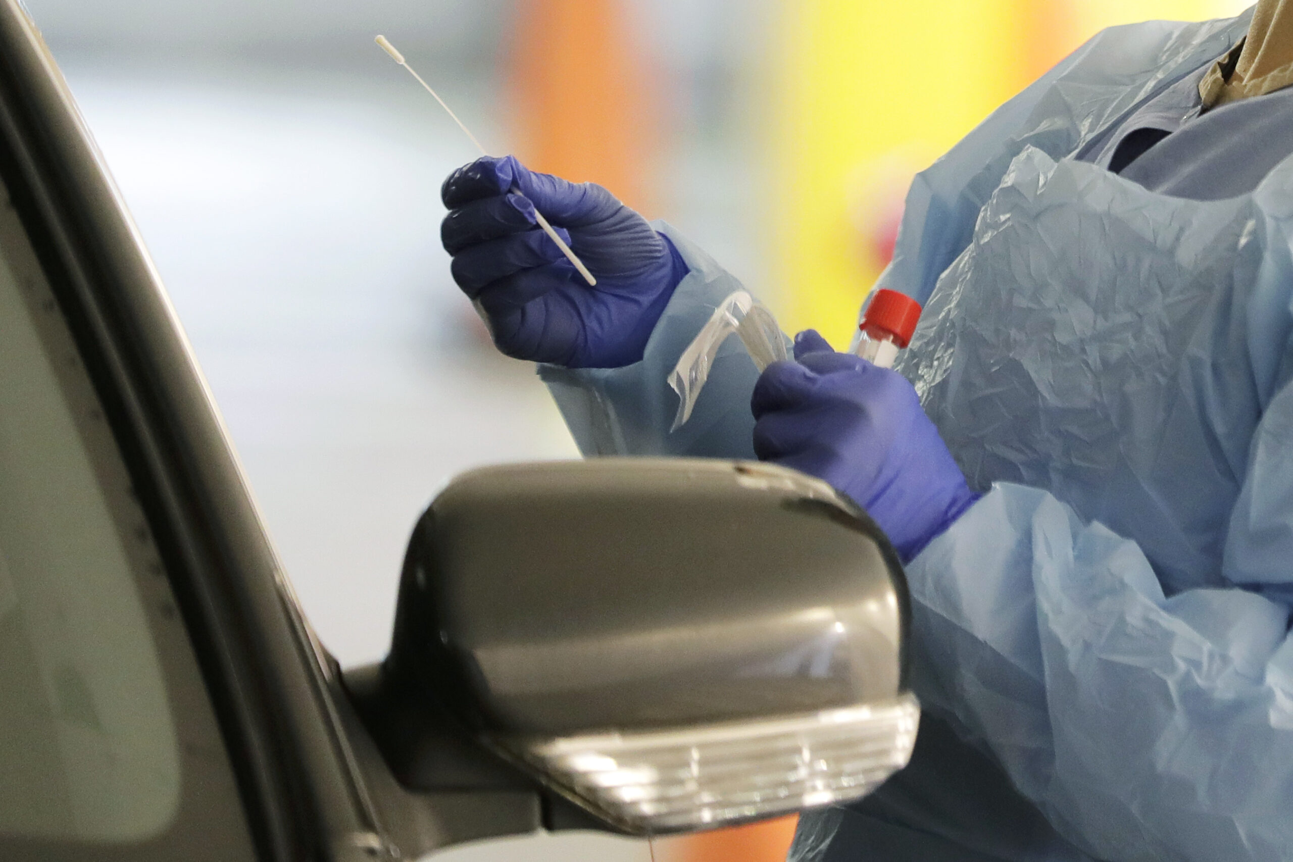 A nurse at a drive up coronavirus testing station