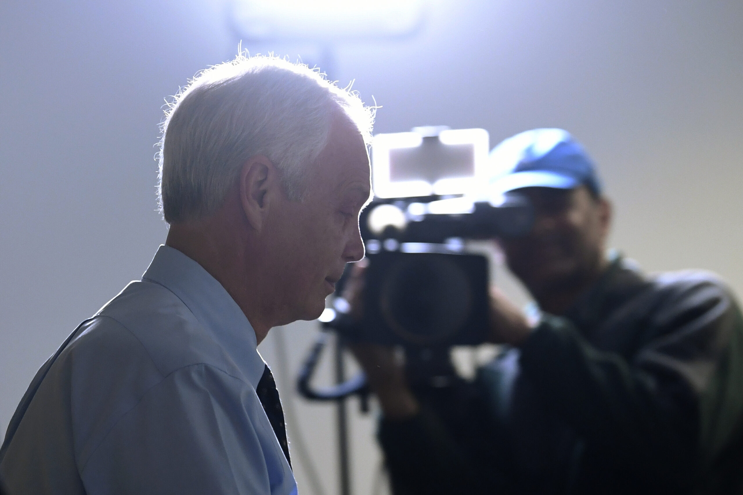 Sen. Ron Johnson, R-Wis., walks past reporters after attending a Republican policy lunch on Capitol Hill in Washington, Thursday, March 19, 2020