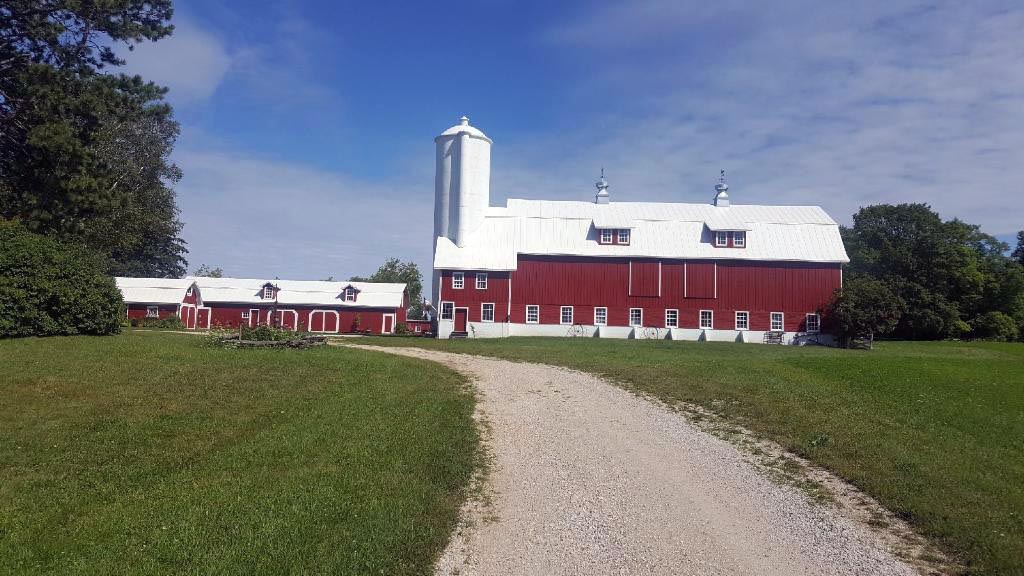 A barn recently painted red by Roberts Brothers Painting, based in Randolph, Wis.