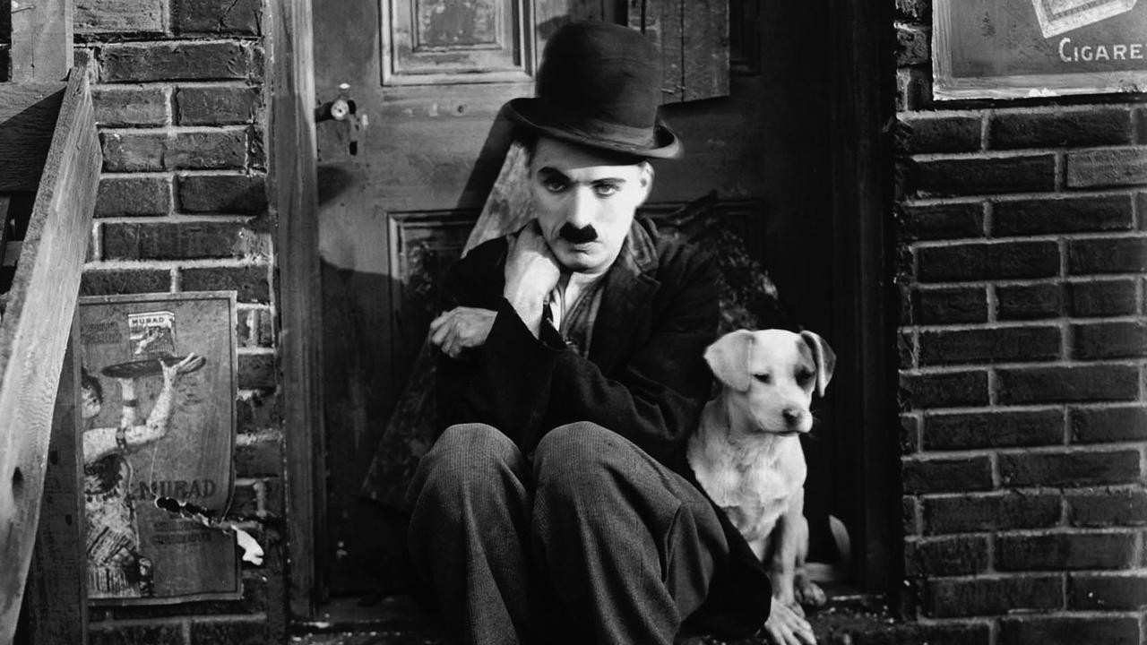 Charlie Chaplin and Scraps the dog in Chaplin's 1918 film, "A Dog's Life"