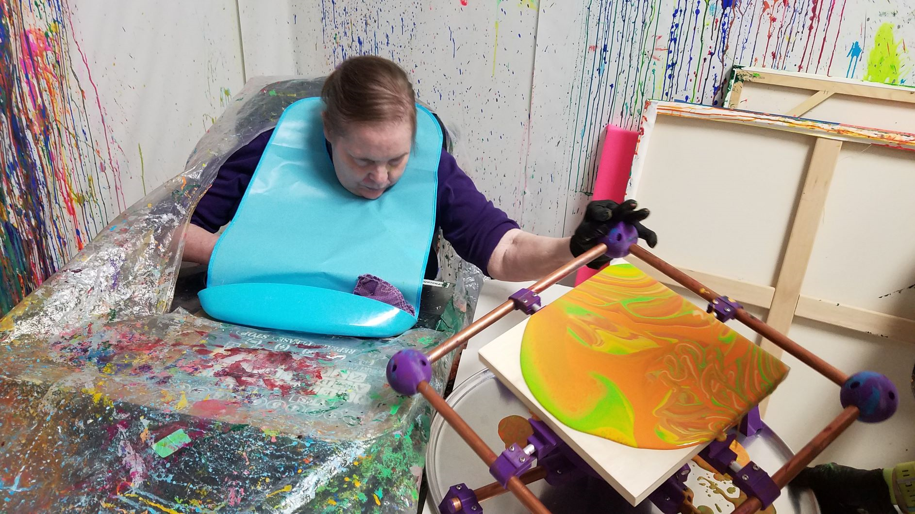 Madison-based artist Jeanne Grosse creates canvas paintings with a tilt table