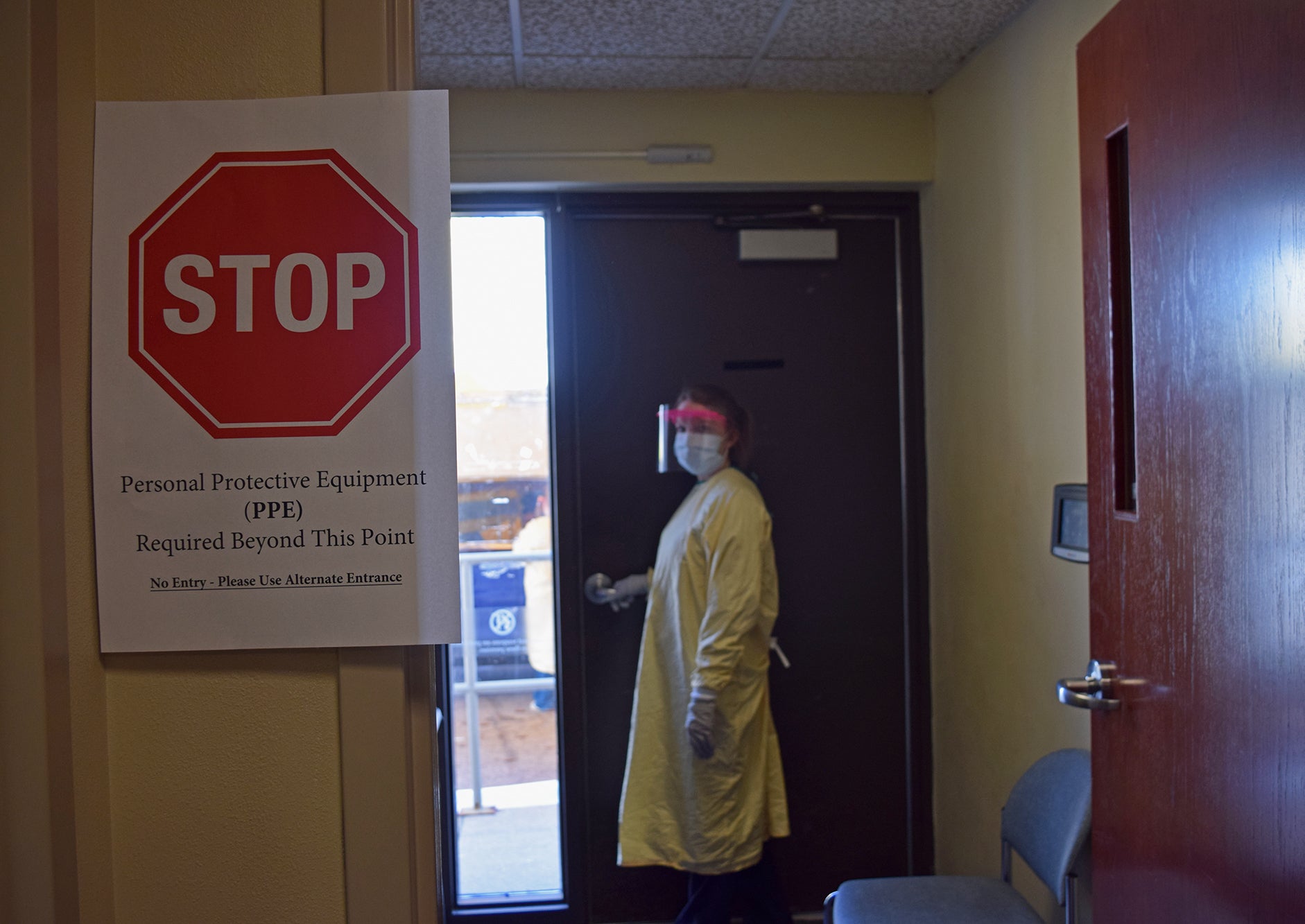 Kelly Groth, a nurse at Mayo Clinic in La Crosse, heads out to the clinic's drive-thru COVID-19 testing station