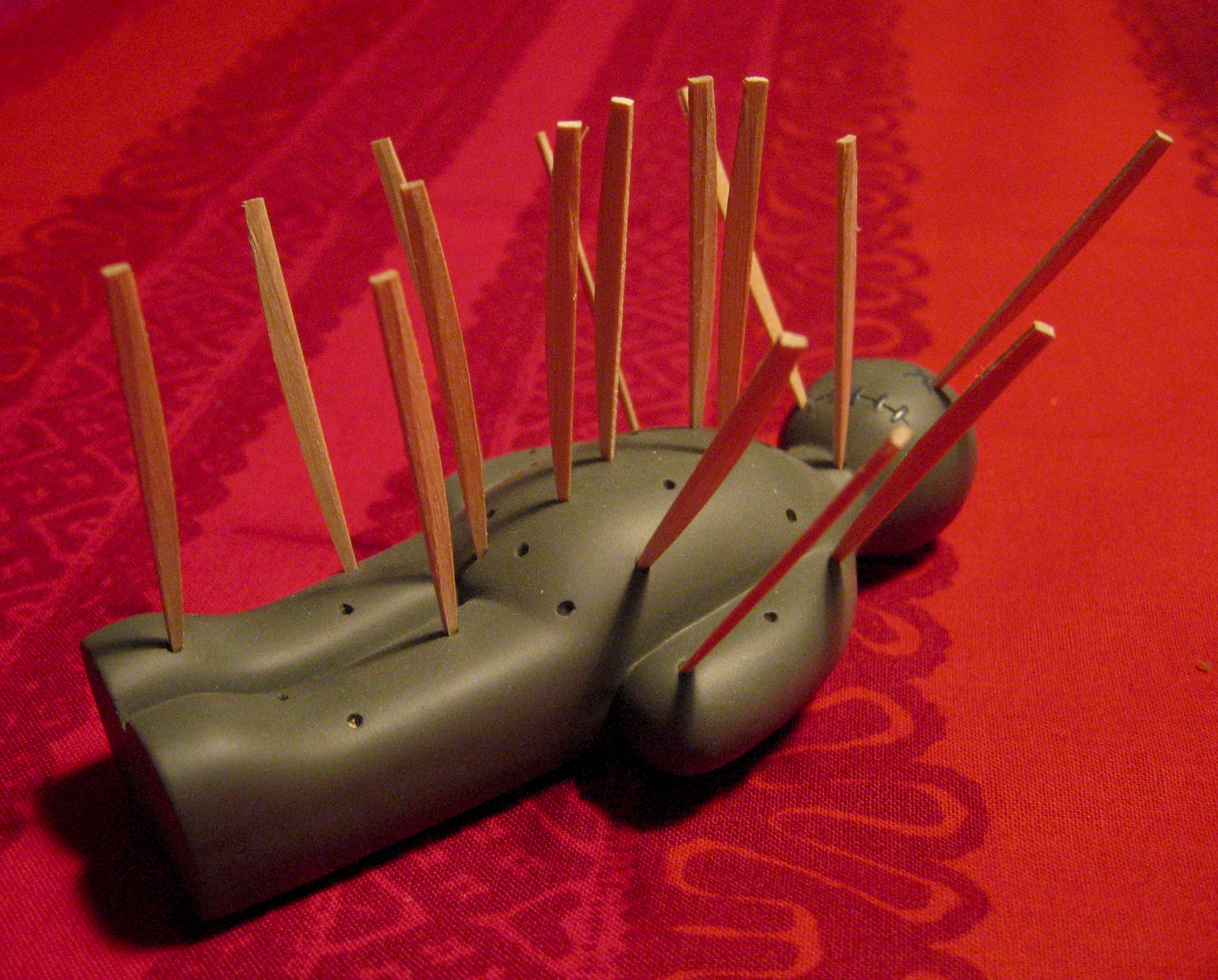 toothpicks stuck in voodoo doll