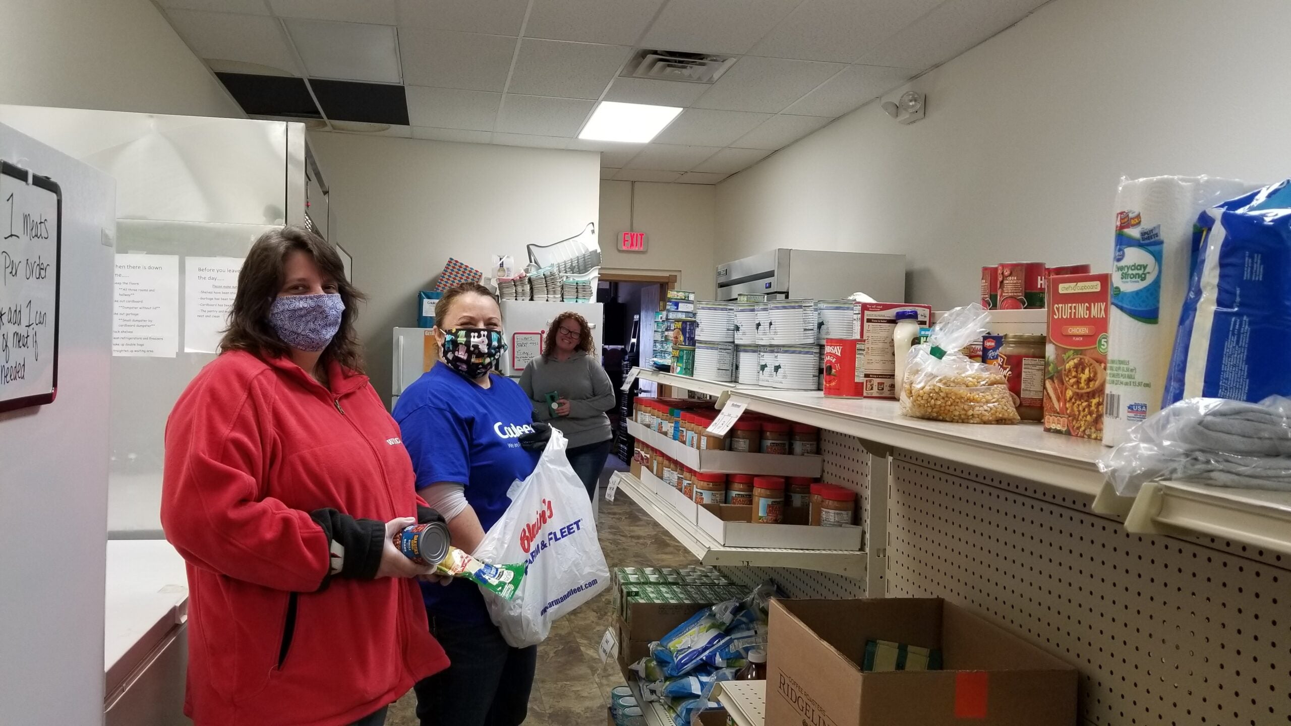 Couleecap employees in Sparta prepare food parcels for curbside pick up and home deliveries.