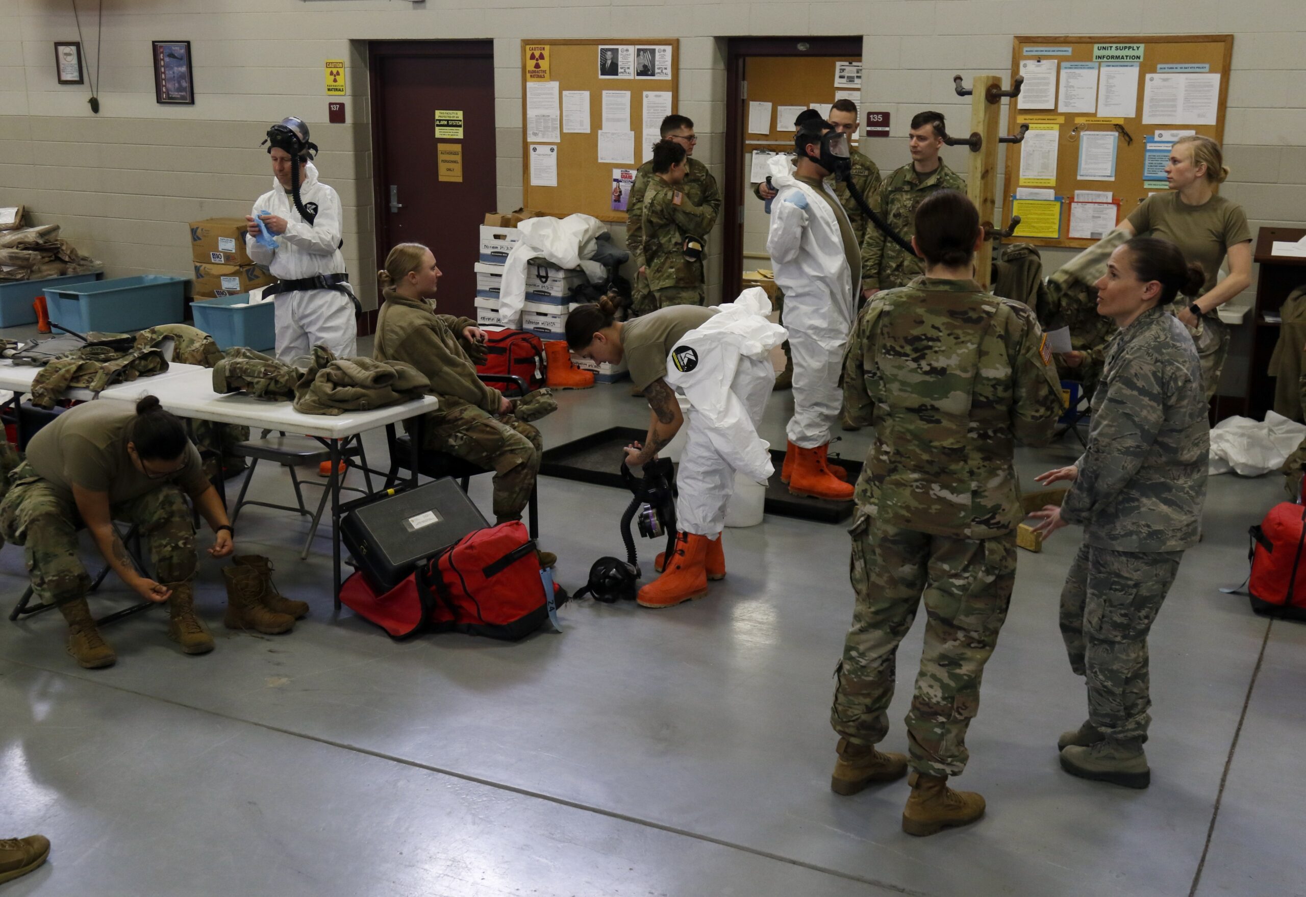 National Guard Soldiers practice putting on protective gear