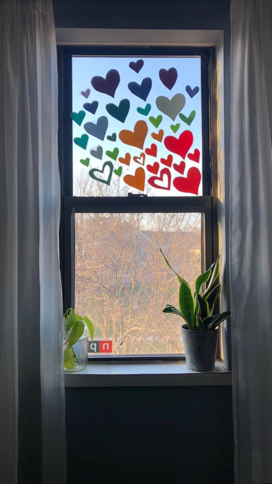 Hearts adorn a window decorated for the Happy Heart Hunt