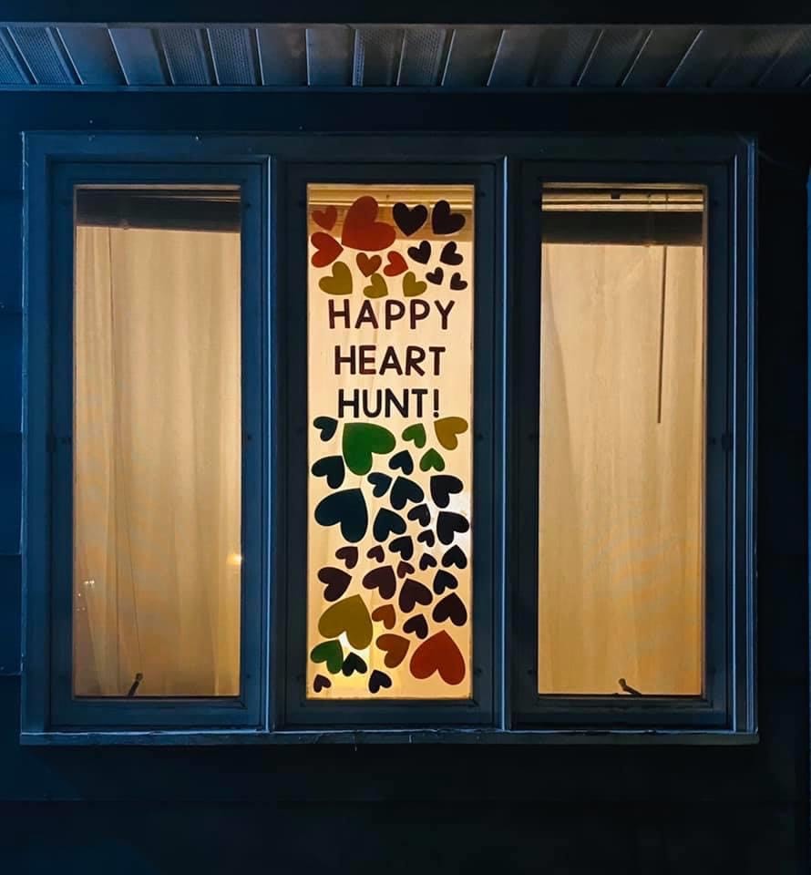 Leslie Brissette's daughter, Allyson Brissette, advertises the Happy Heart Hunt on one of the windows at her home in Beloit