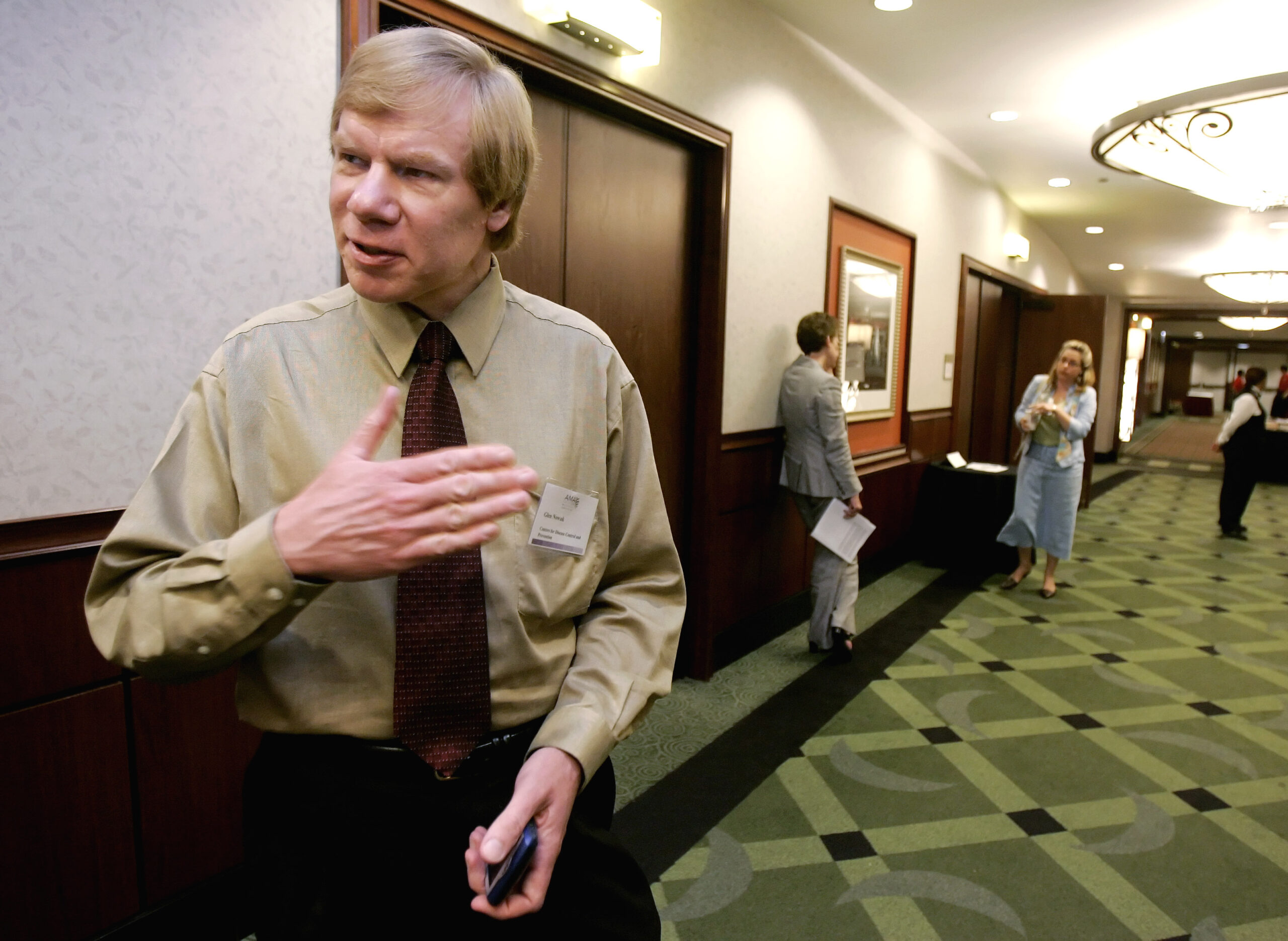 Glen Nowak, of the Centers for Disease Control and Prevention, pauses in a hall after addressing a National Influenza Vaccine Summit