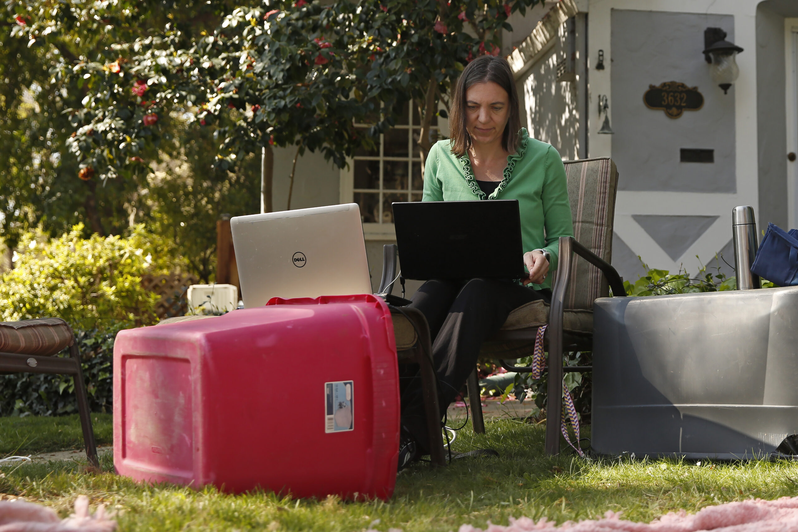 Alison Steffensen works at the home office she set up in the front yard of her home in Sacramento, Calif.