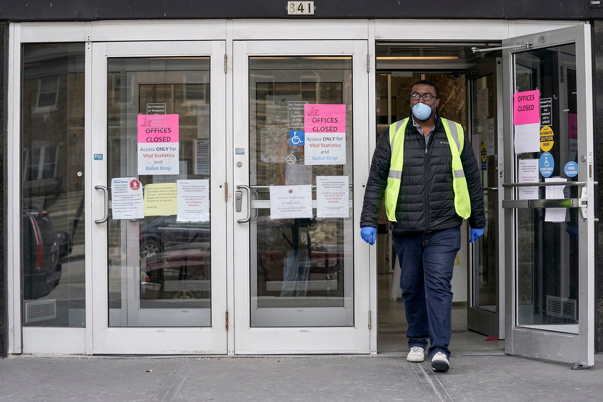 A worker leaves the Frank P. Zeidler Municipal Building in Milwaukee