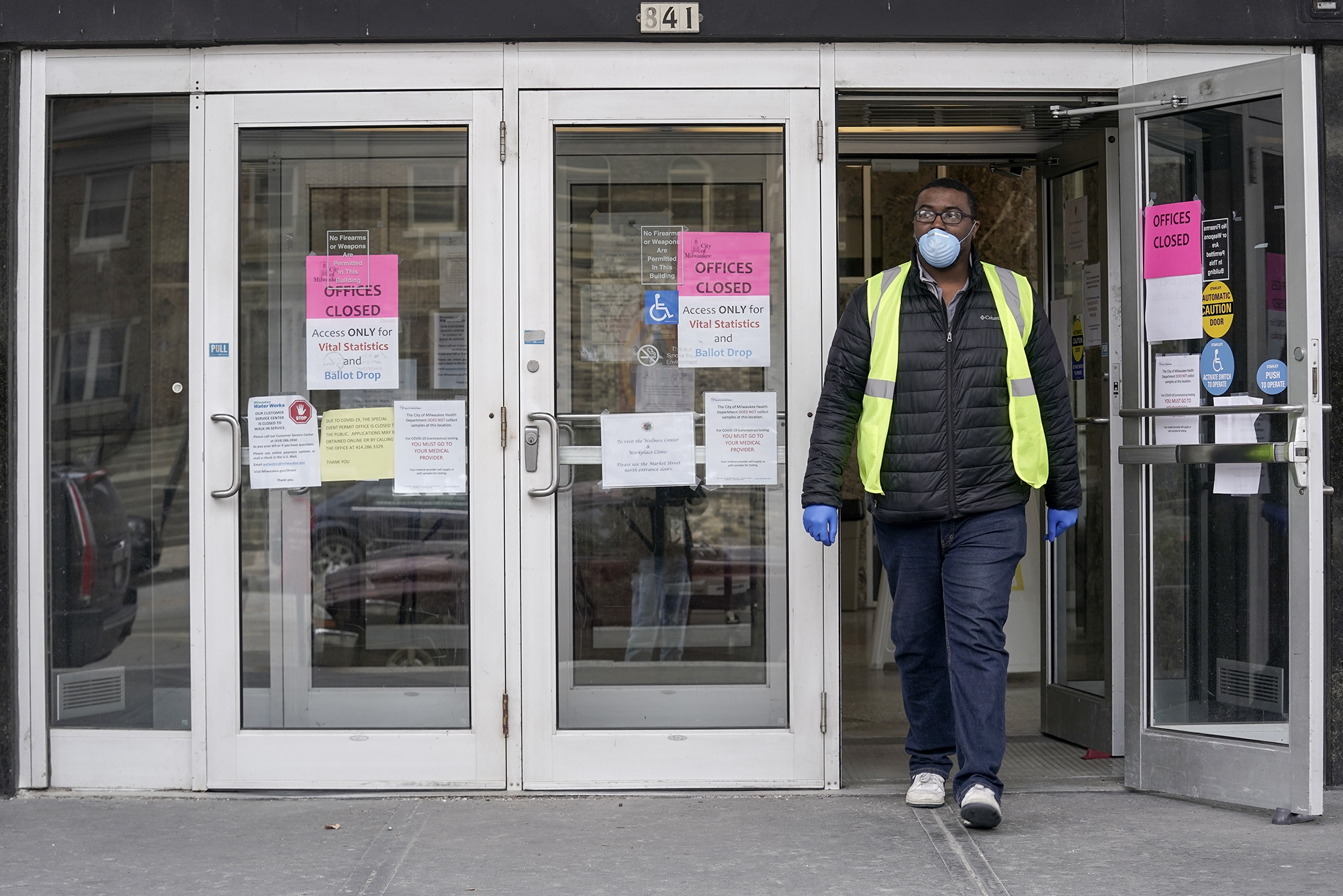 A worker leaves the Frank P. Zeidler Municipal Building in Milwaukee